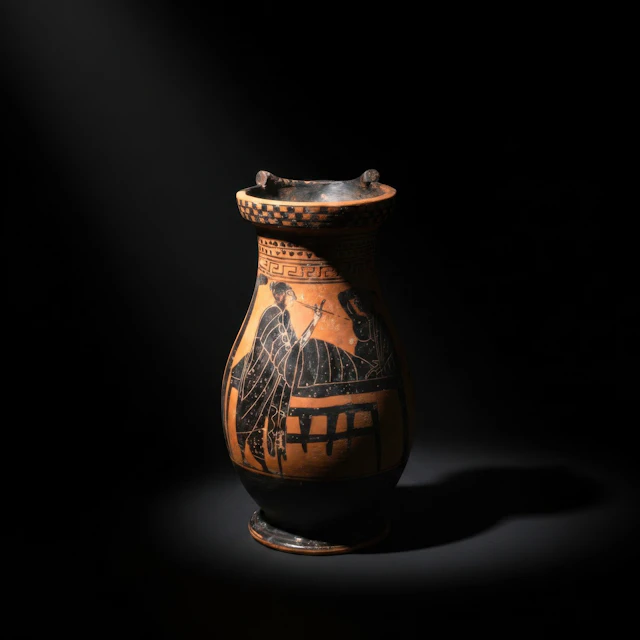 GREEK BLACK-FIGURE OLPE WITH SYMPOSIUM SCENE