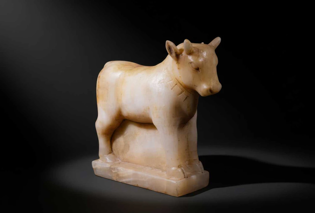LARGE SOUTH ARABIAN ALABASTER BULL WITH PECTORAL