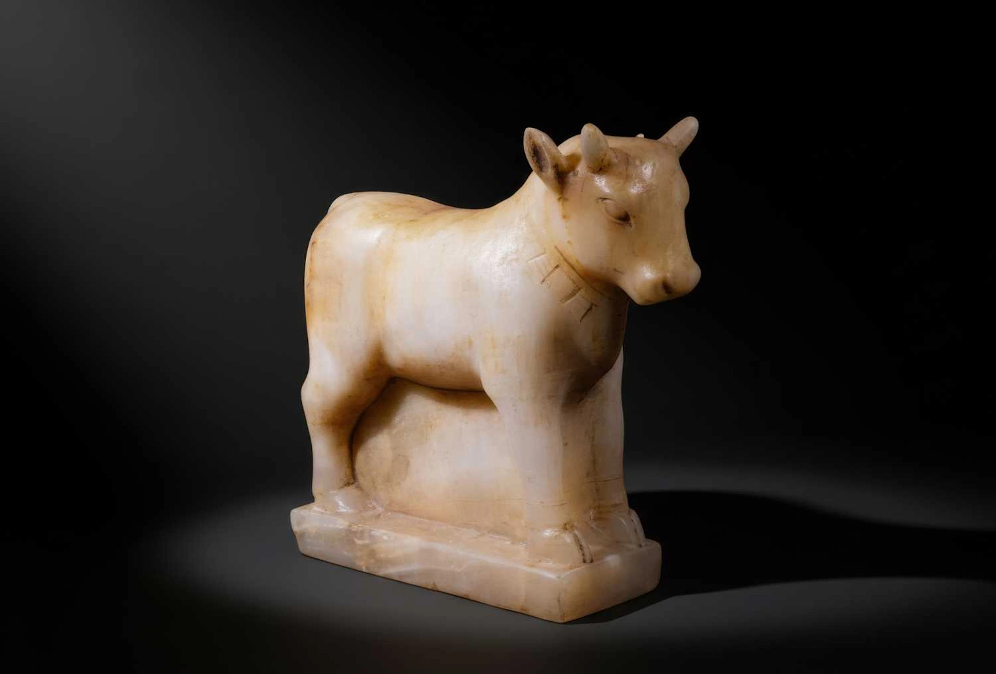 LARGE SOUTH ARABIAN ALABASTER BULL WITH PECTORAL