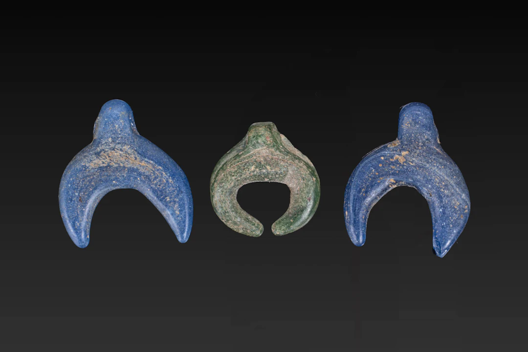 COLLECTION OF ROMAN GLASS LUNULA PENDANTS