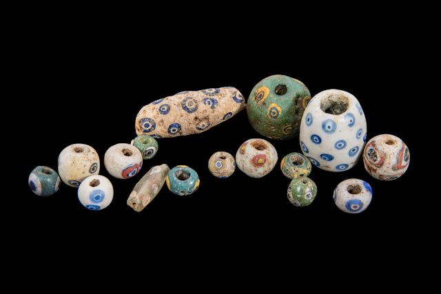 COLLECTION OF GRAECO-PHOENICIAN POLYCHROME GLASS BEADS