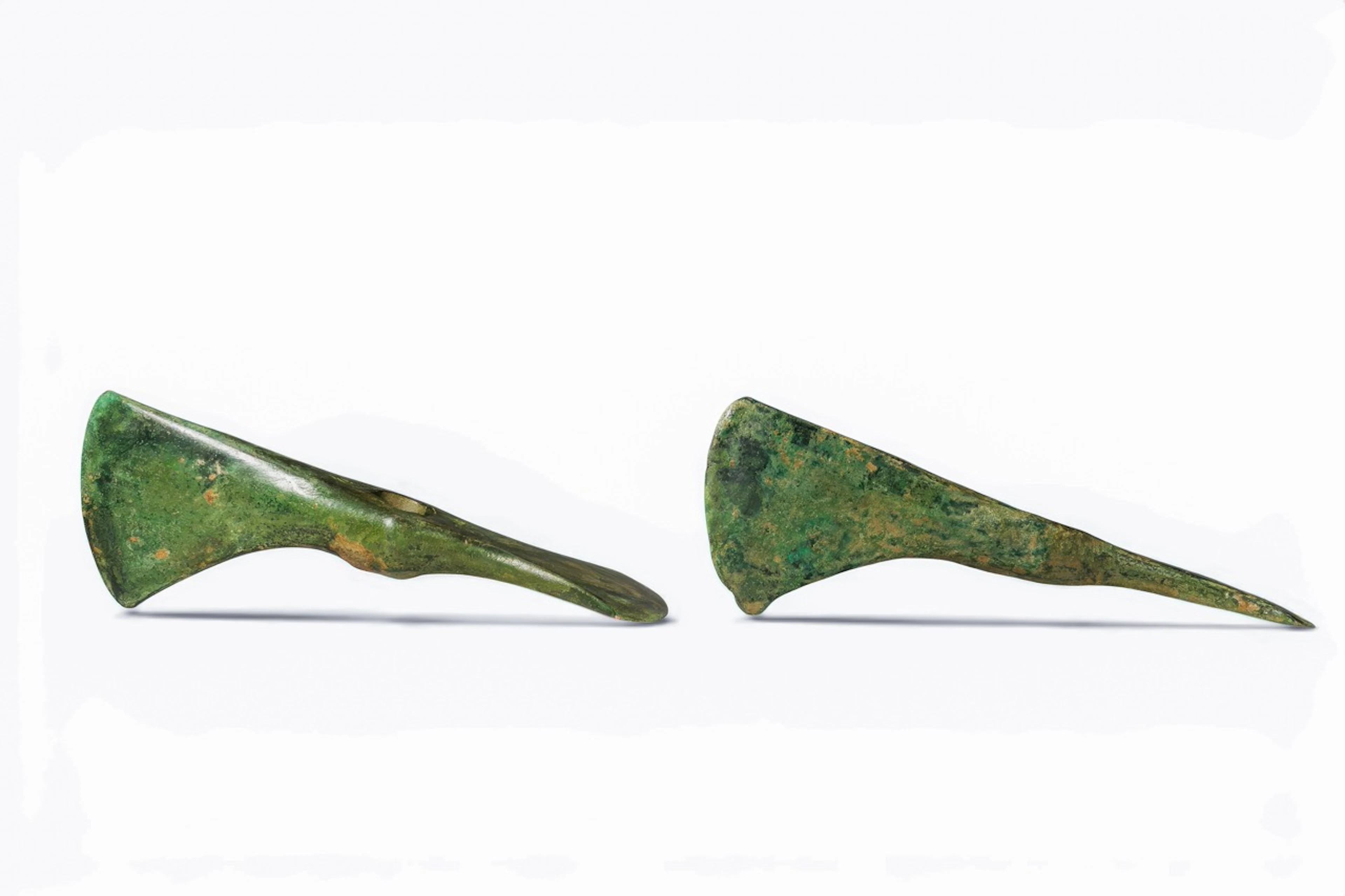 PAIR OF BRONZE AGE BRONZE AXE-ADZE HEADS
