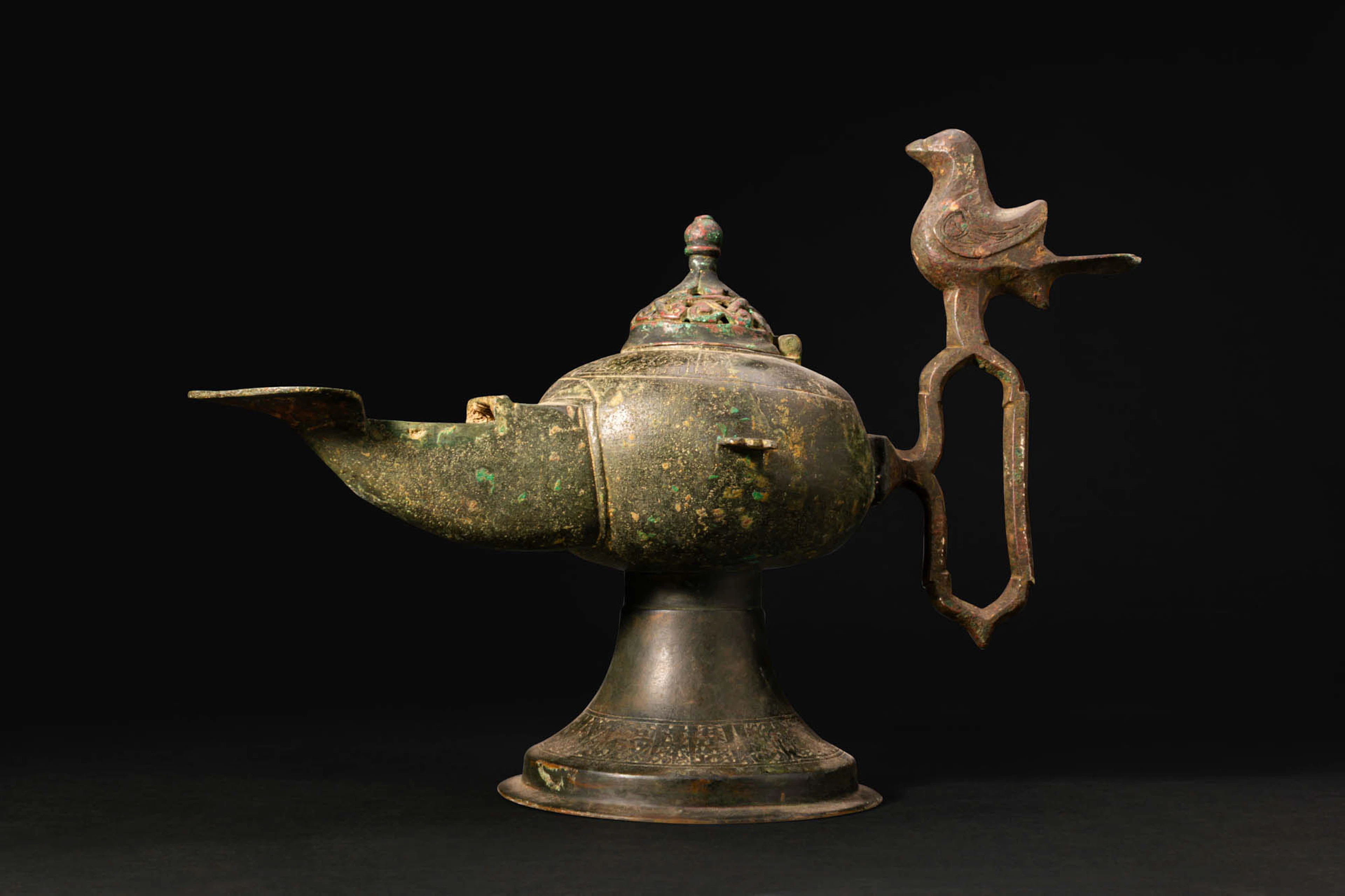 SELJUK BRONZE DOUBLE-WICKED OIL LAMP WITH BIRD FINIAL