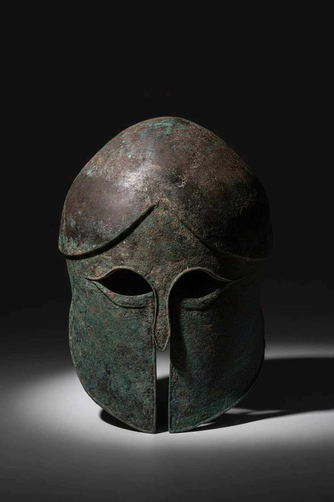RARE CORINTHIAN BRONZE HELMET OF THE HERMIONE TYPE