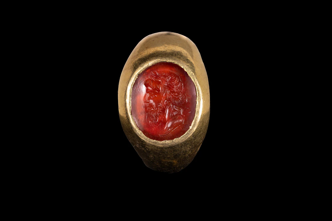 ROMAN SOLID GOLD RING WITH CARNELIAN INTAGLIO OF JUPITER