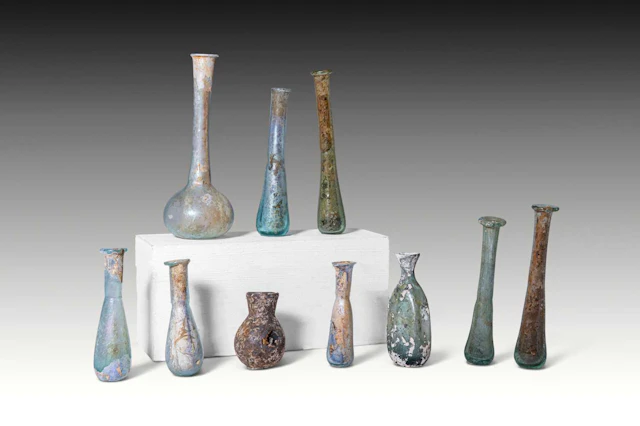 LARGE COLLECTION OF TEN ROMAN GLASS UNGUENTARIA