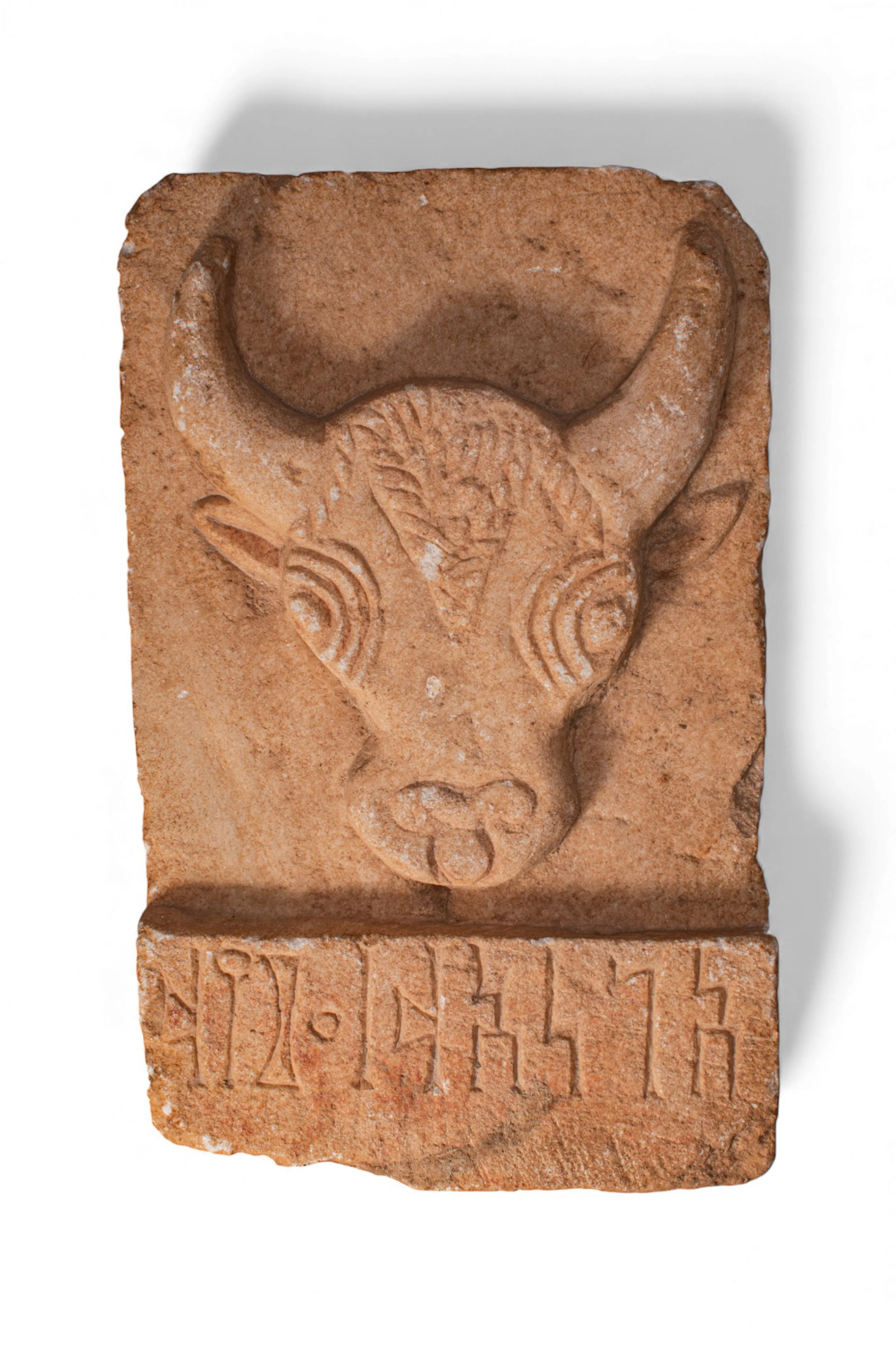 SOUTH ARABIAN STONE STELA WITH BULL'S HEAD AND INSCRIPTION