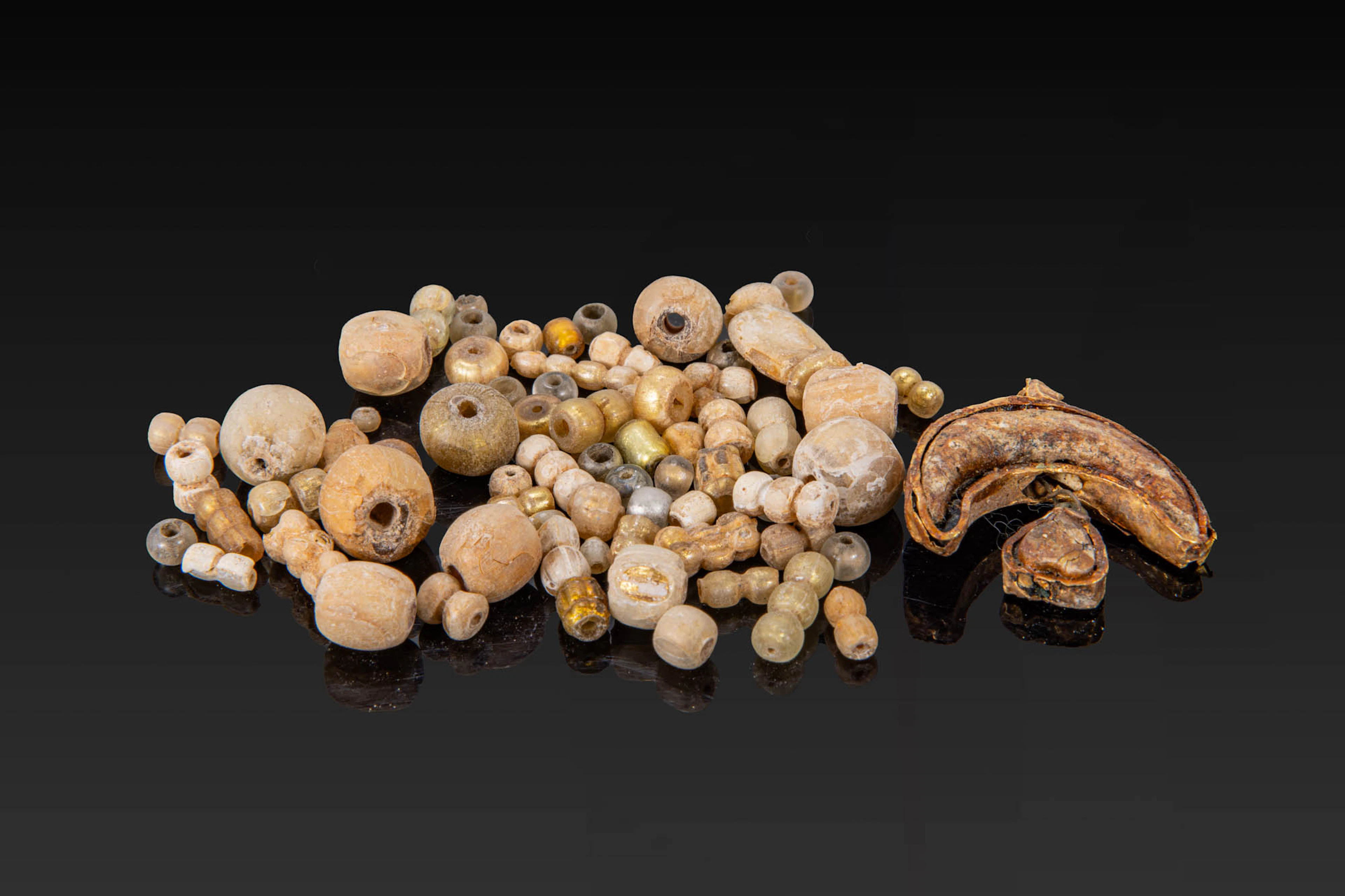 LARGE COLLECTION OF VIKING GOLD LEAF GLASS BEADS AND LUNULA PENDANT