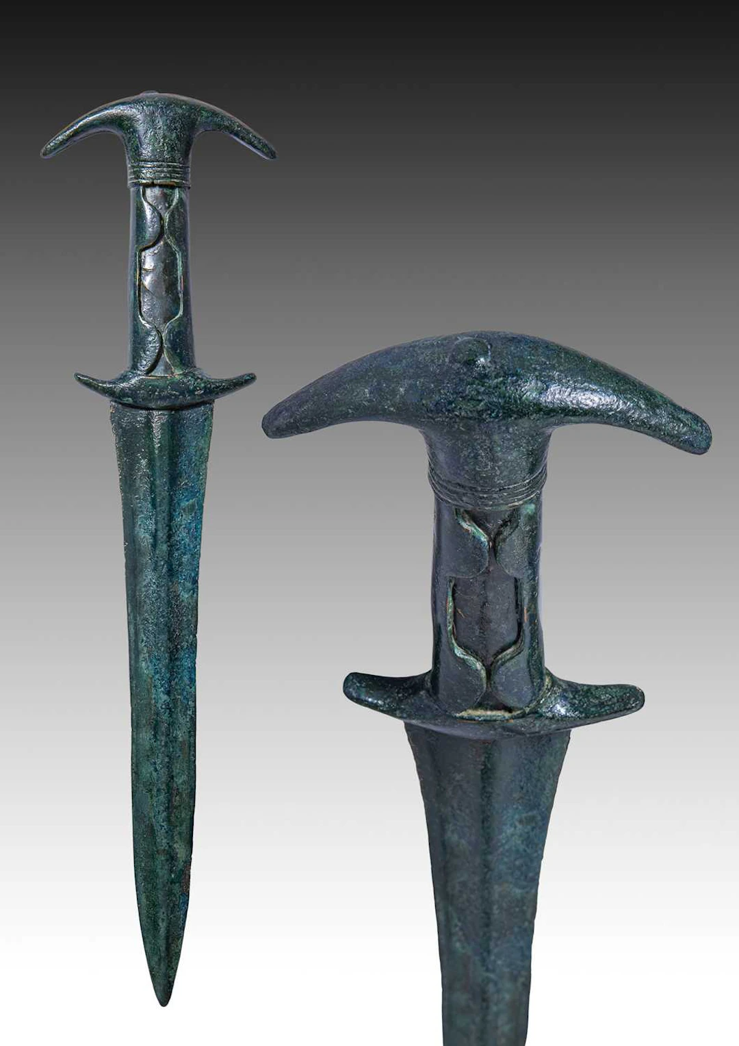 HITTITE BRONZE SWORD WITH EAR-SHAPED POMMEL AND DECORATED HANDLE