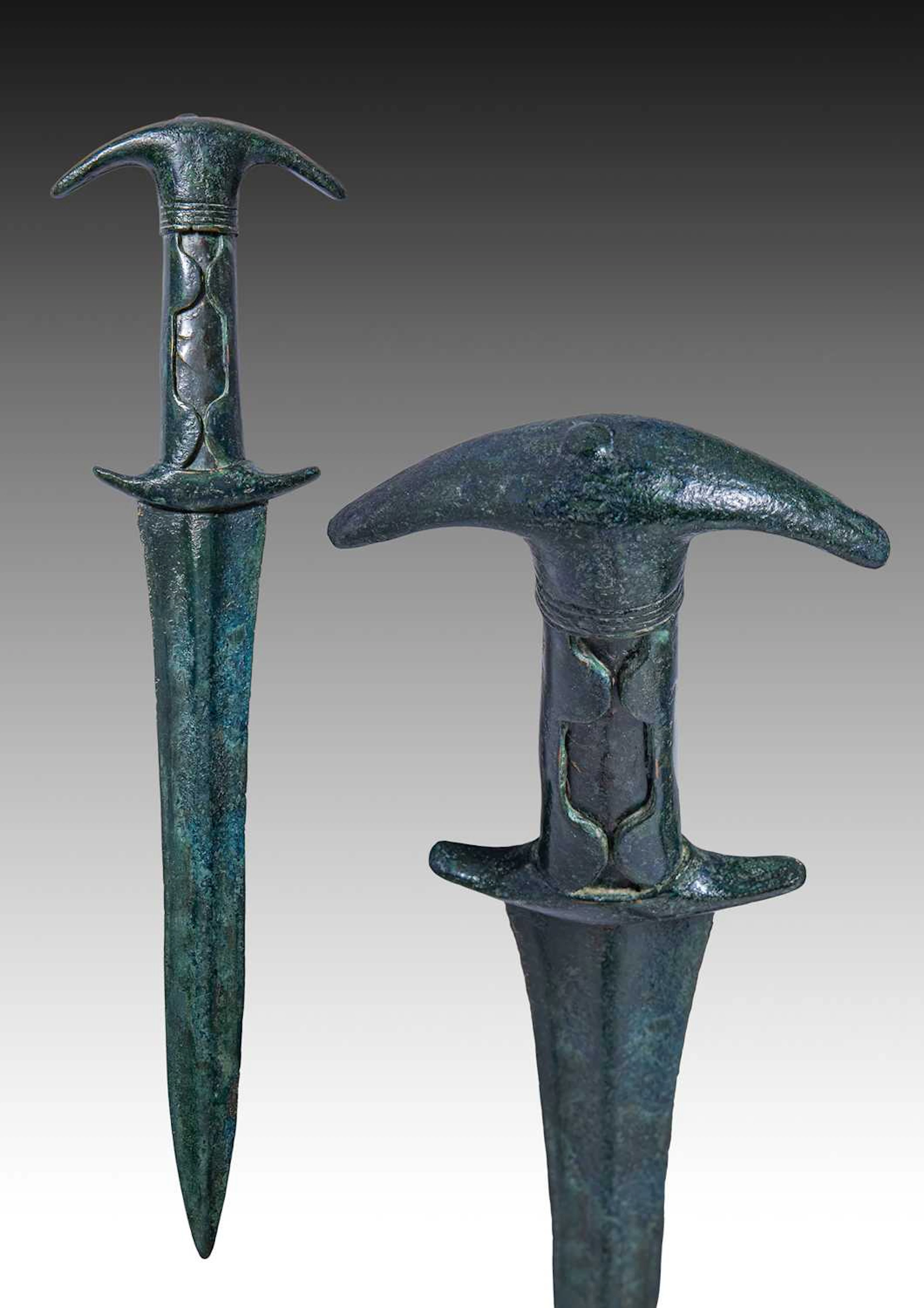 HITTITE BRONZE SWORD WITH EAR-SHAPED POMMEL AND DECORATED HANDLE
