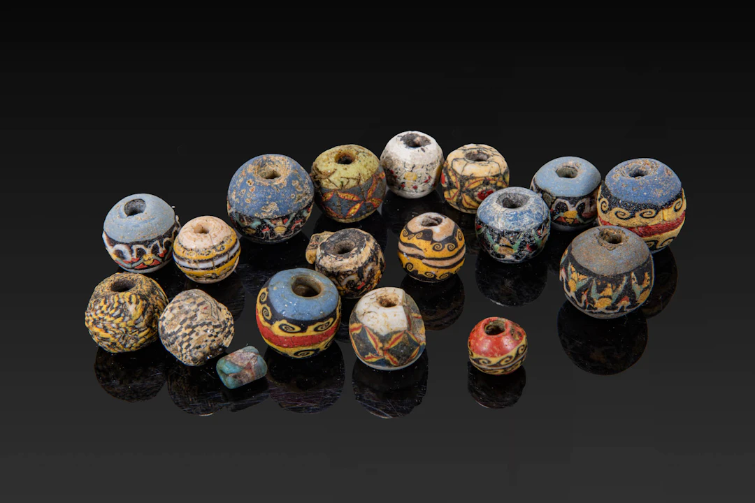 COLLECTION OF ROMAN MOSAIC GLASS BEADS WITH WAVE AND GEOMETRICAL MOTIFS