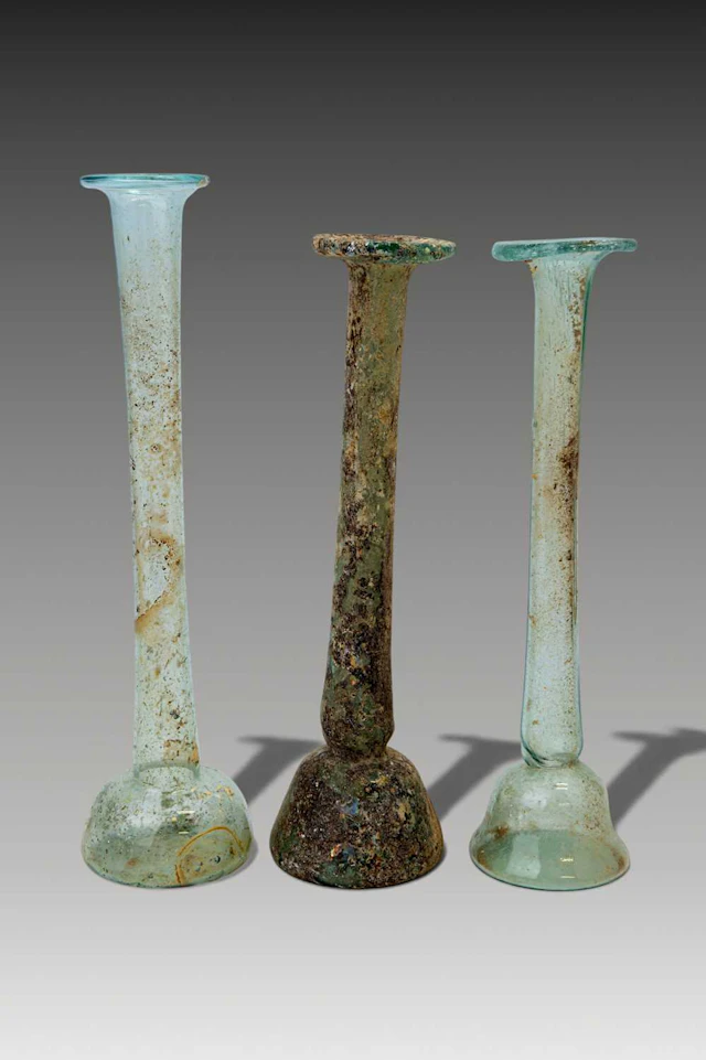 COLLECTION OF ROMAN GLASS TALL UNGUENTARIA