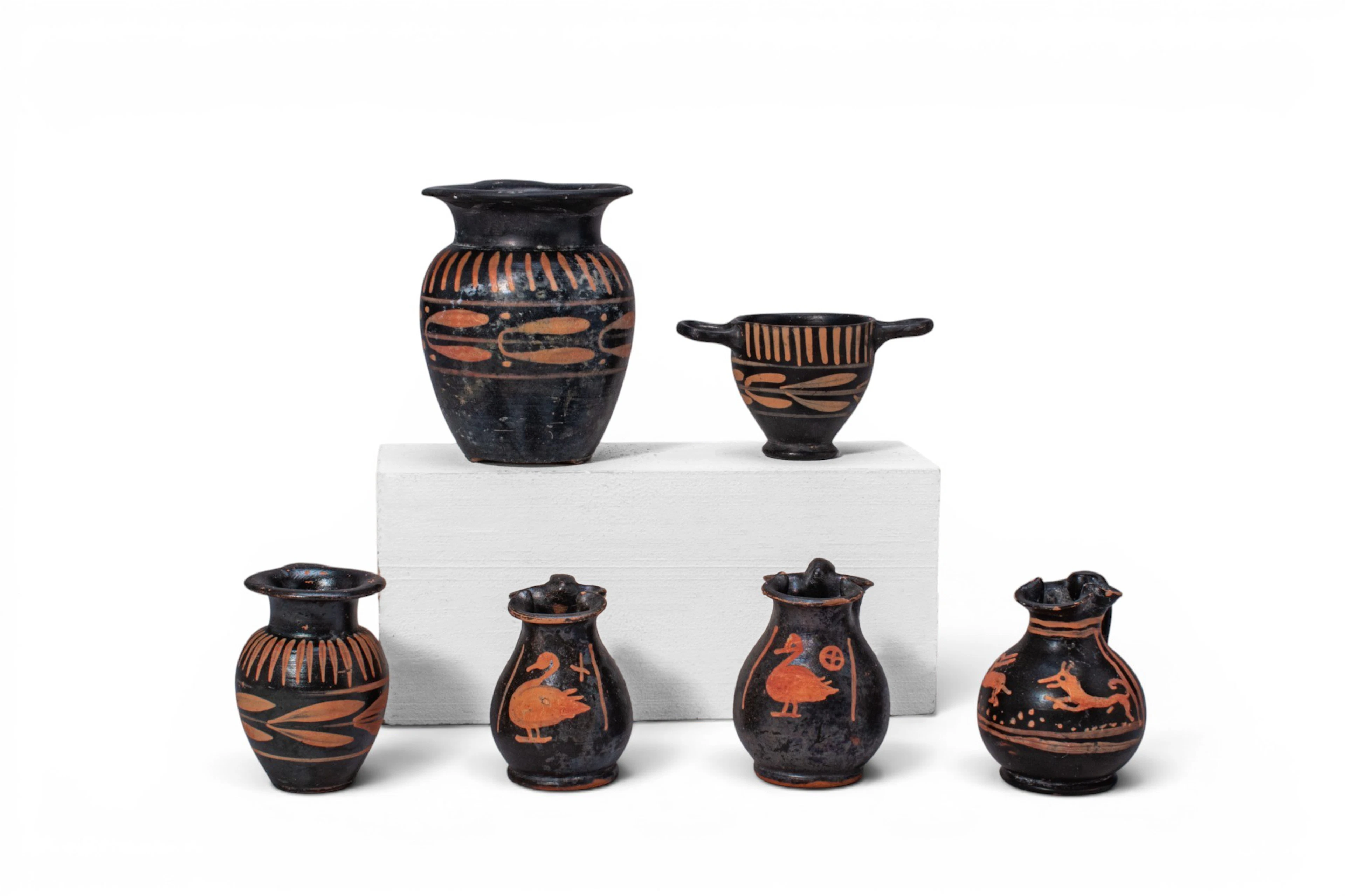 COLLECTION OF XENON WARE VESSELS WITH ANIMALS AND OLIVE LEAVES