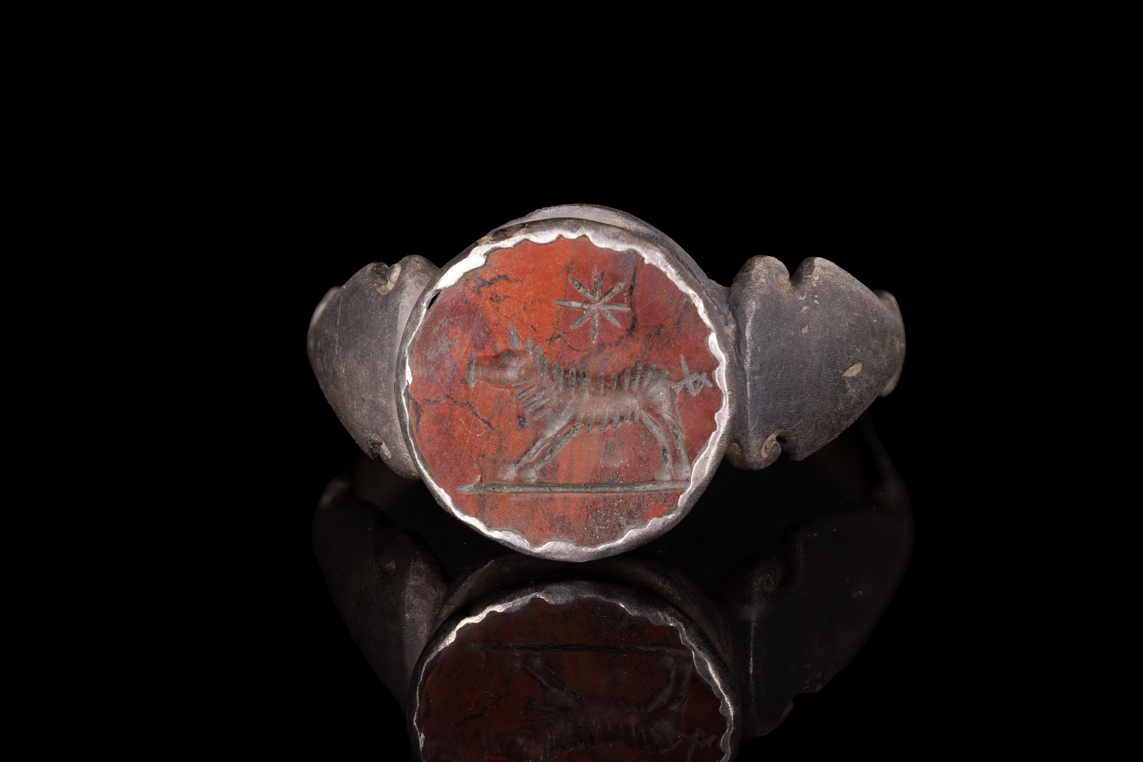 EASTERN ROMAN RED JASPER INTAGLIO WITH WOLF AND STAR IN SILVER RING