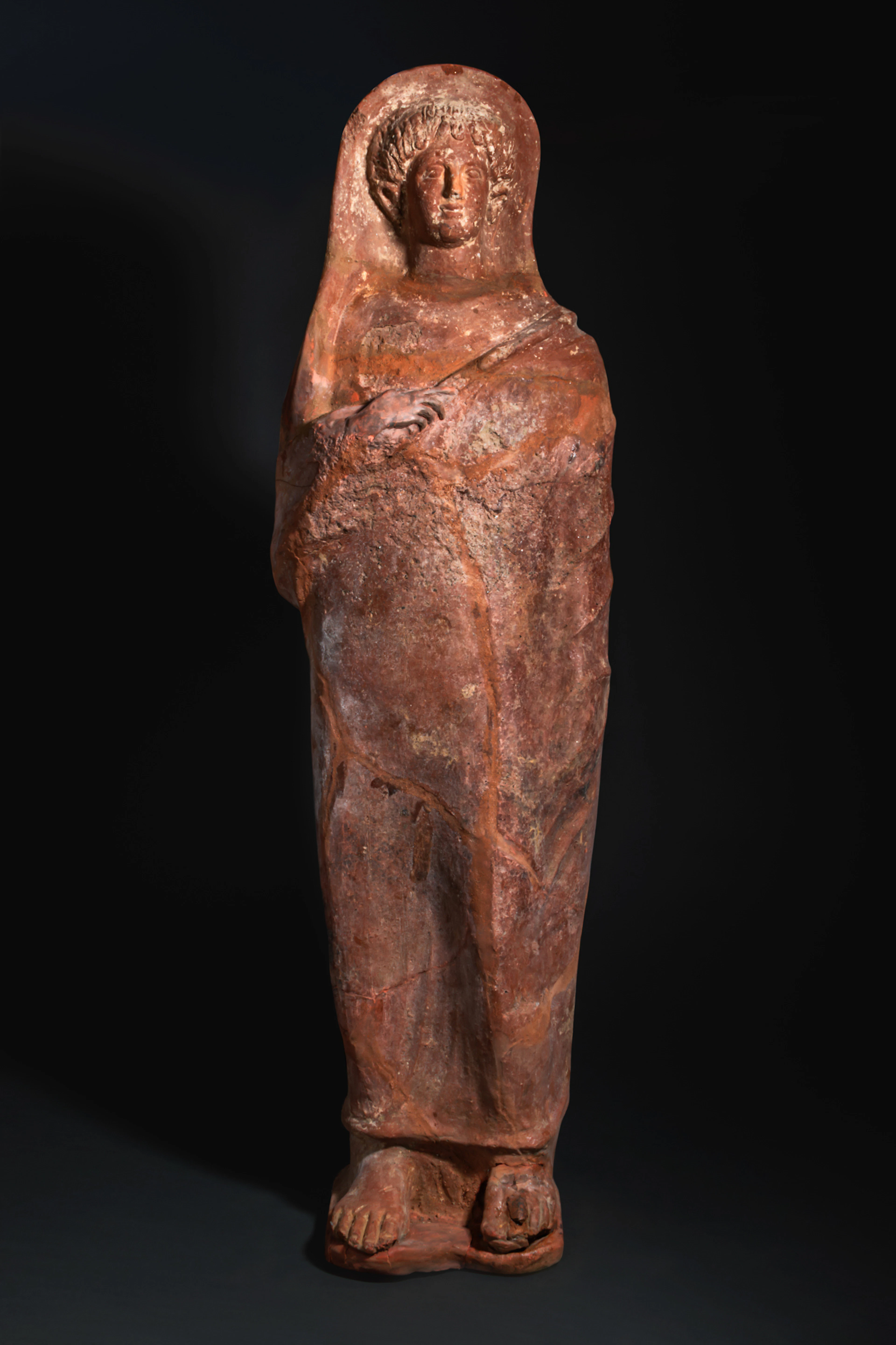 ETRUSCAN TERRACOTTA FIGURE OF AN OFFERING WOMAN