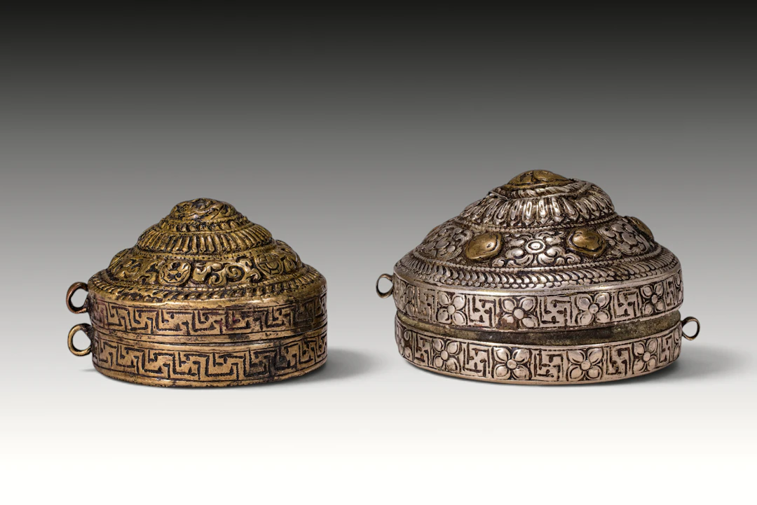 TWO BHUTANESE LIME CONTAINERS