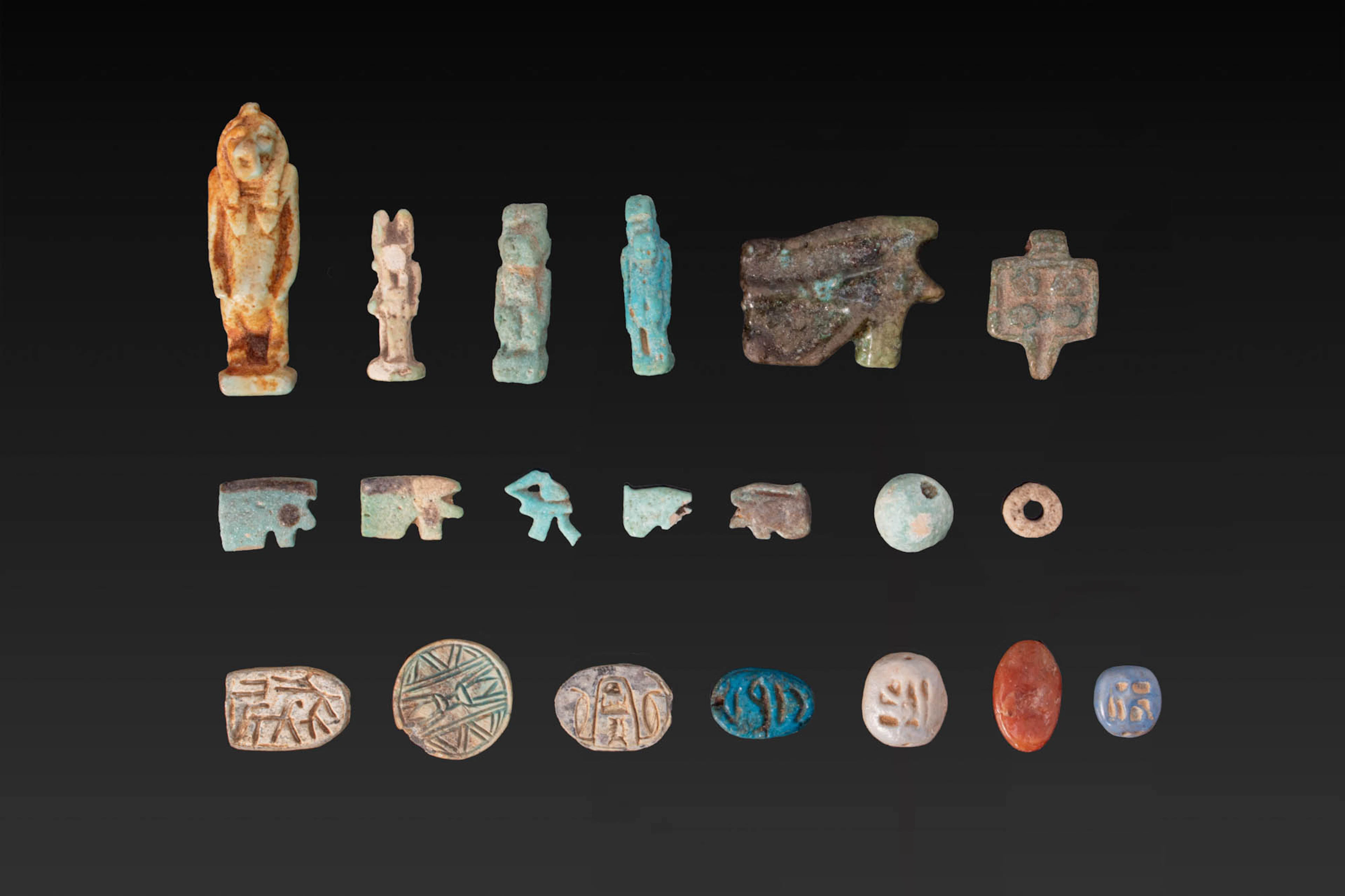 LARGE COLLECTION OF EGYPTIAN FAIENCE AND STONE AMULETS