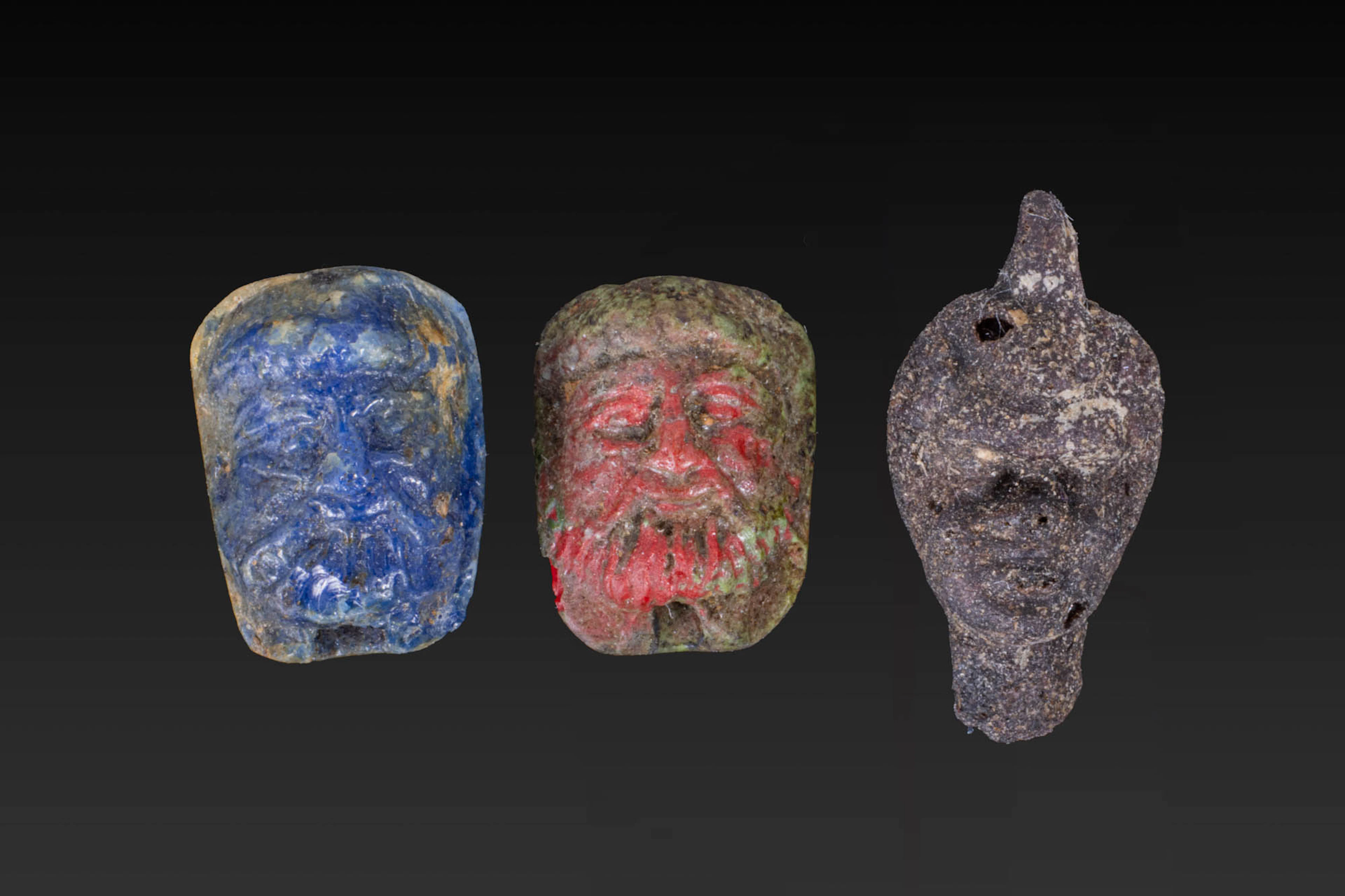 COLLECTION OF RARE ROMAN GLASS FACE BEADS