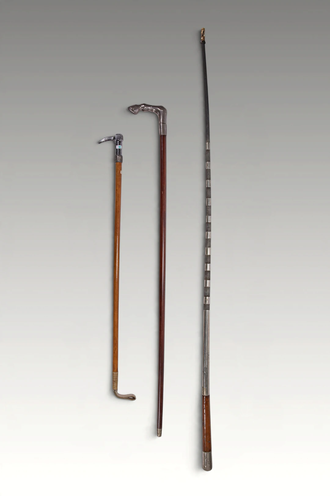 WALKING STICK WITH SILVER HORSE HOOF AND A HORSE WHIP