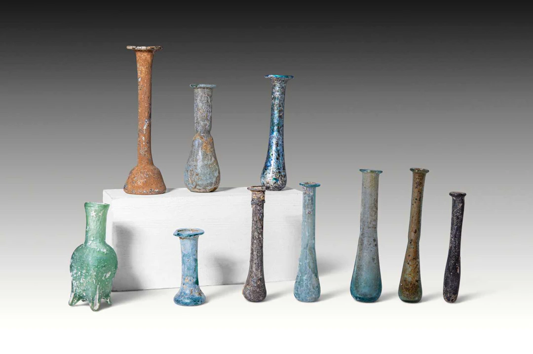 LARGE COLLECTION OF TEN ROMAN GLASS UNGUENTARIA