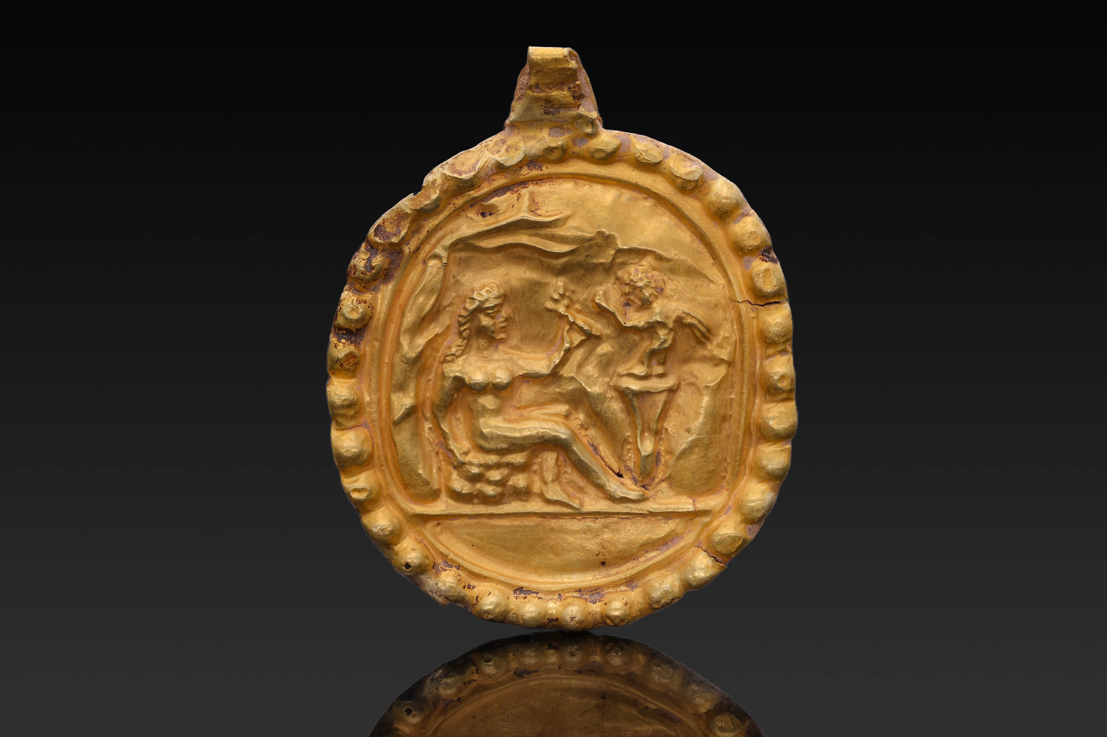 GREEK GOLD MEDALLION WITH APHRODITE AND EROS ON PODIUM