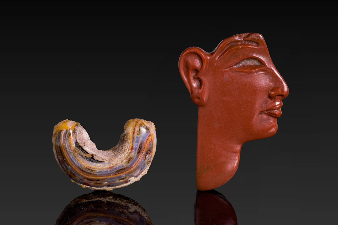 EGYPTIAN RED JASPER FACE INLAY AND POLYCHROME GLASS COLLAR