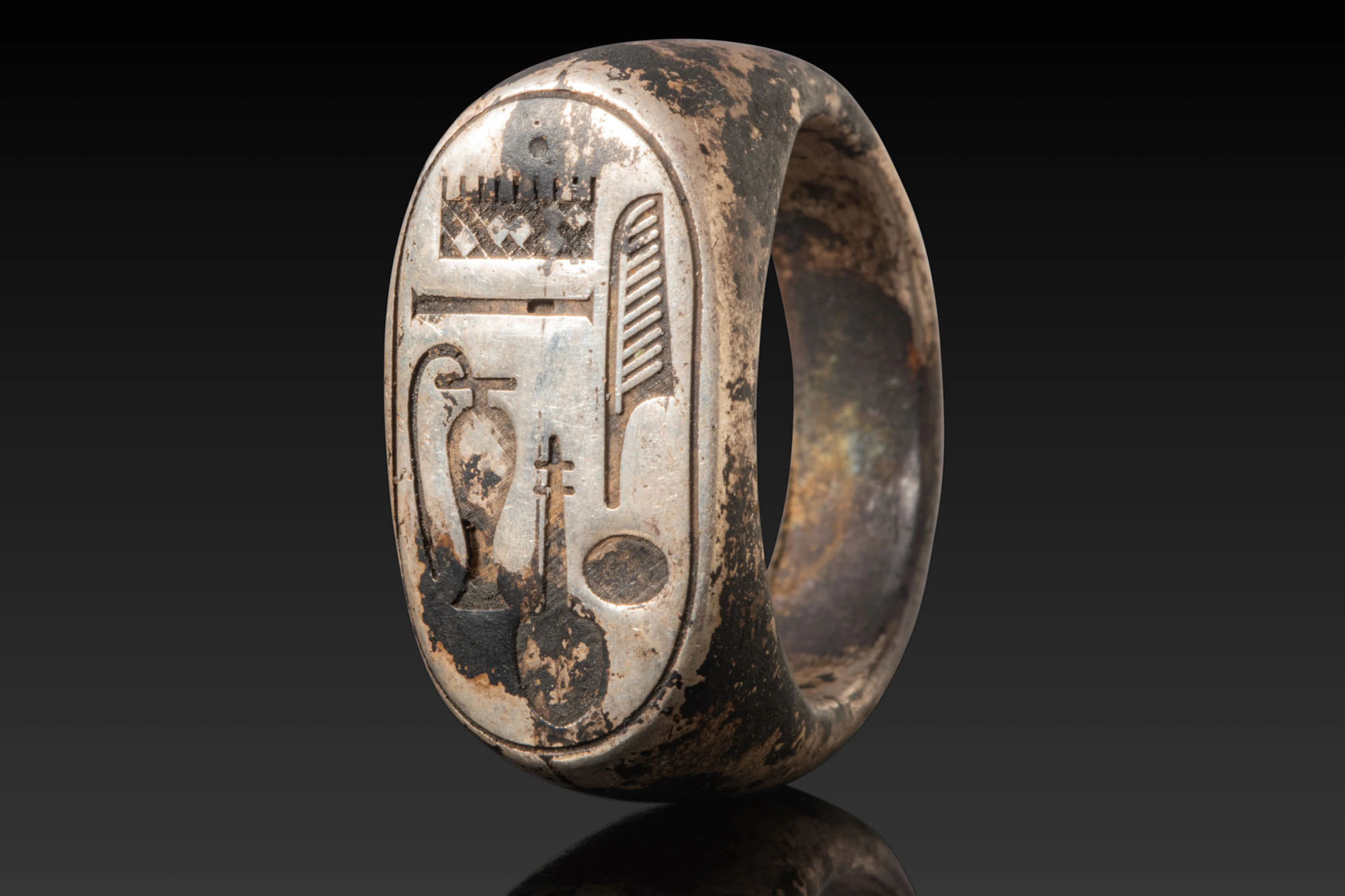 EGYPTIAN SILVER STIRRUP RING WITH CARTOUCHE