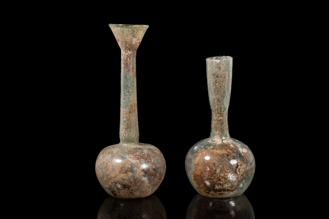 PAIR OF LARGE ROMAN GLASS APPLE-SHAPED UNGUENTARIA