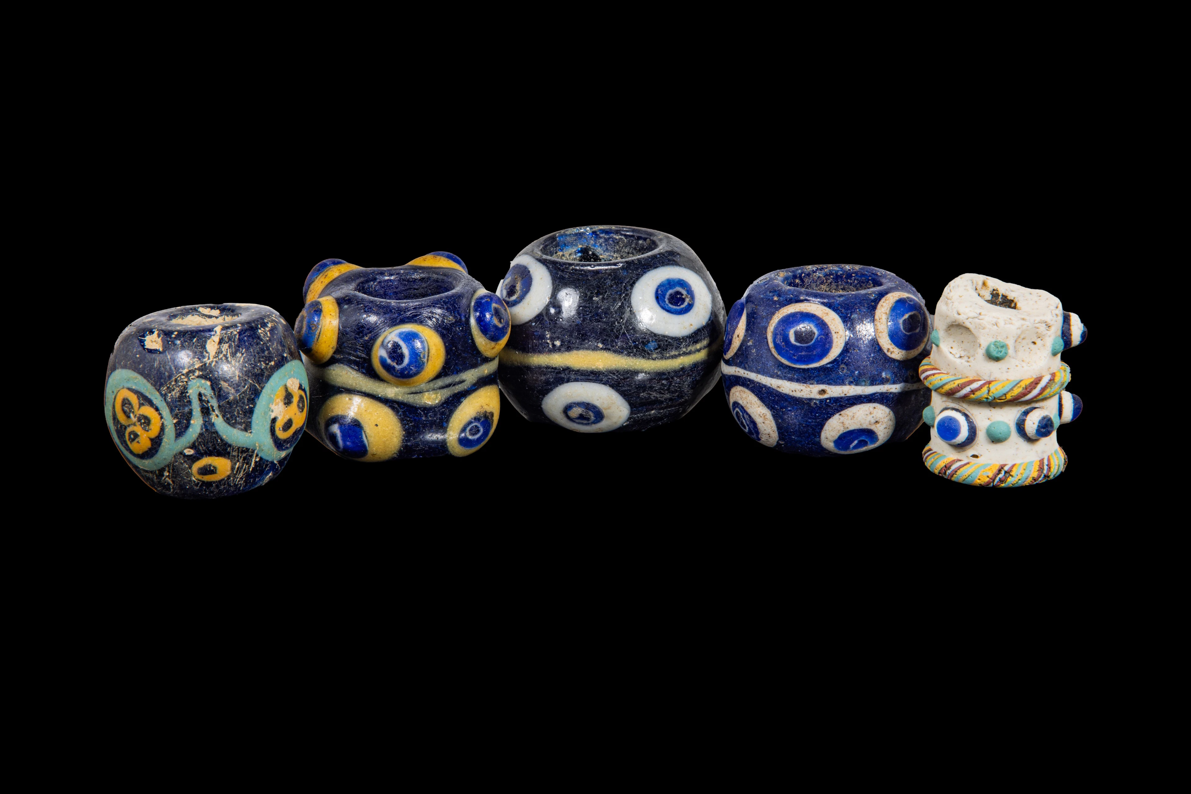 COLLECTION OF LARGE PHOENICIAN POLYCHROME GLASS EYE BEADS