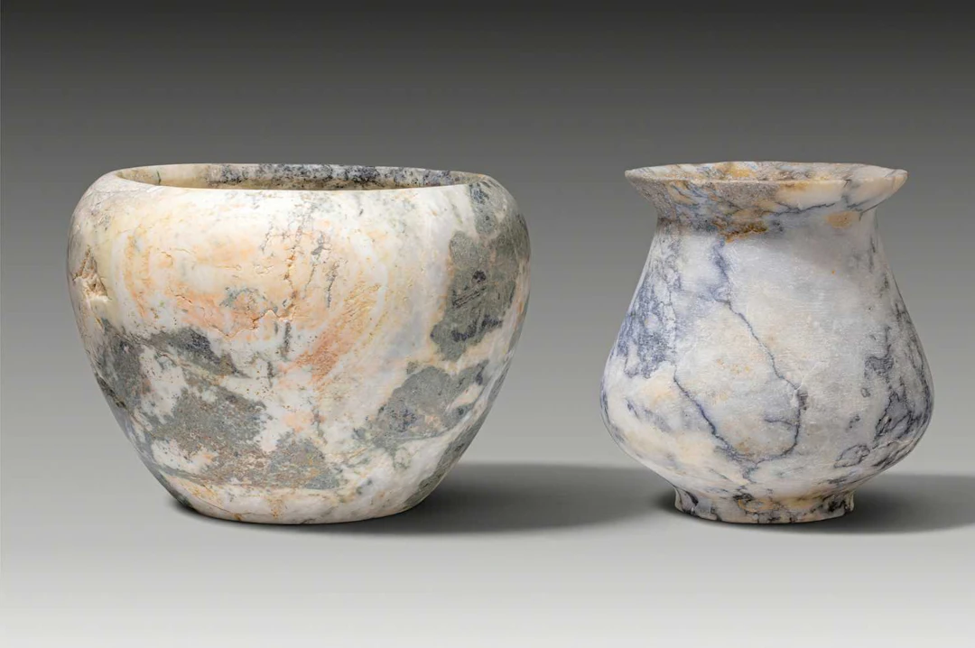 PAIR OF EGYPTIAN BRECCIA STONE OFFERING VESSELS