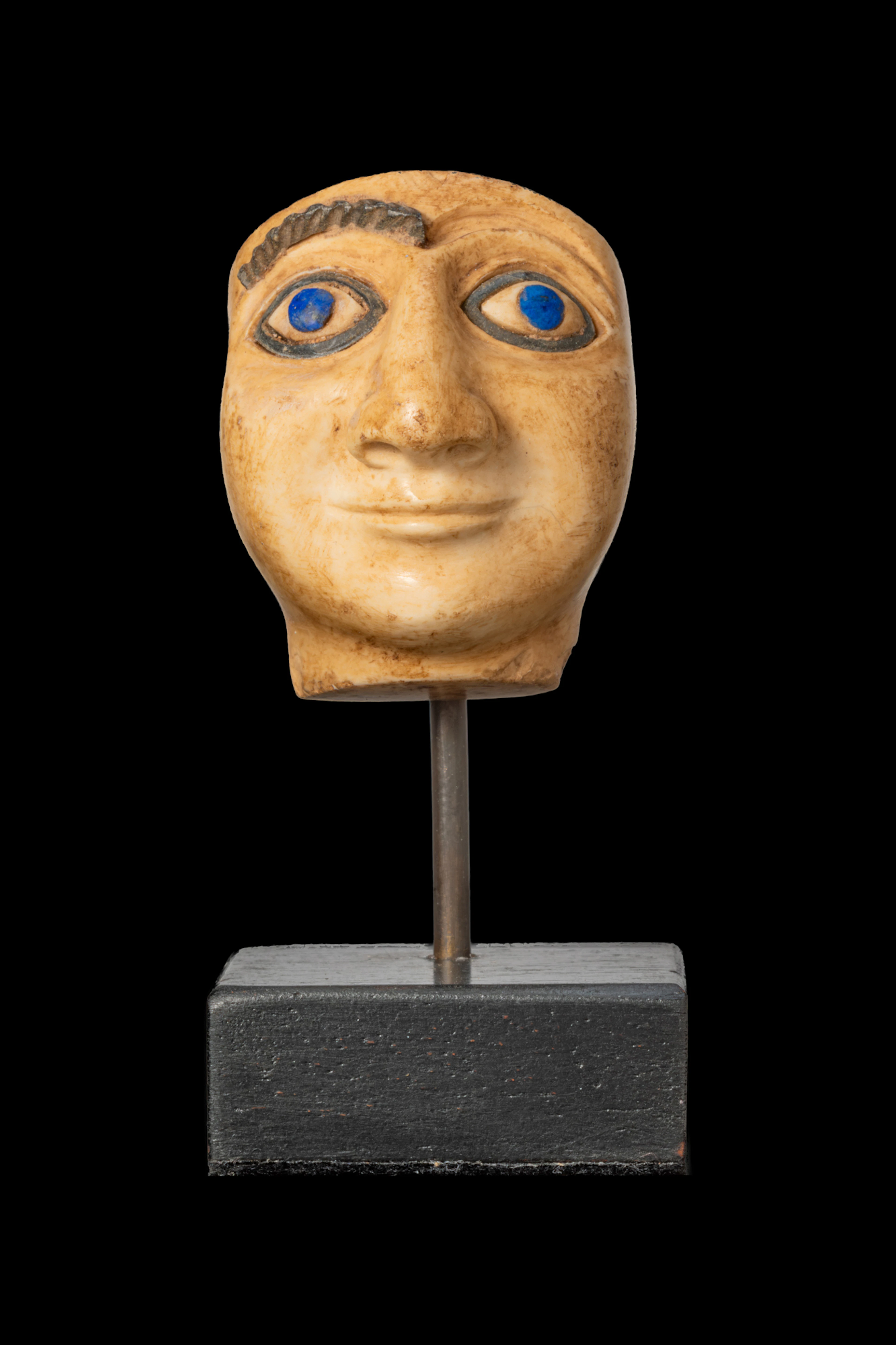MESOPOTAMIAN STONE HEAD OF A WORSHIPPER WITH INLAID EYES AND BROW