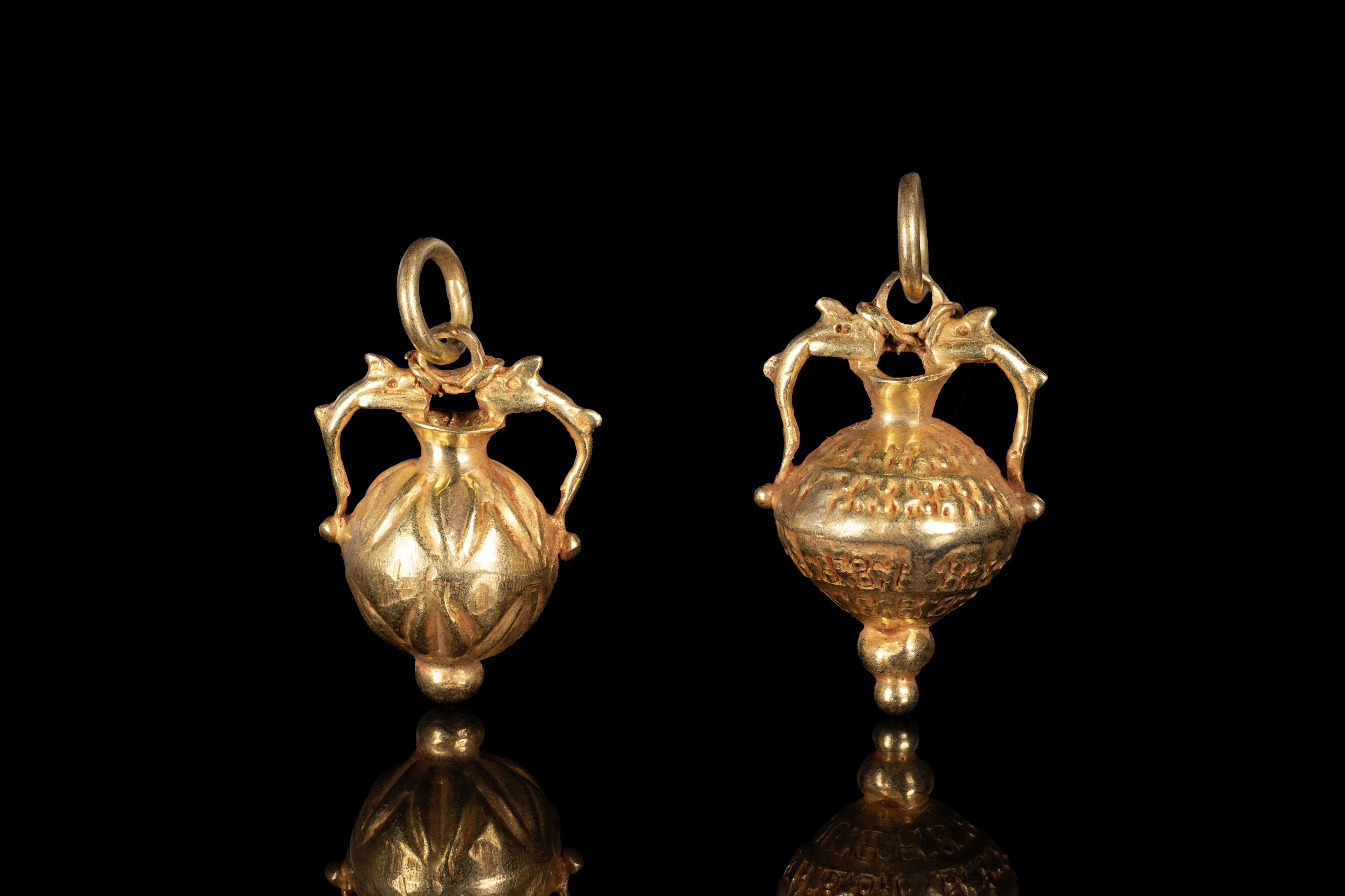 PAIR OF ROMANO EGYPTIAN GOLD AMPHORA-SHAPED PENDANTS WITH DOLPHINS