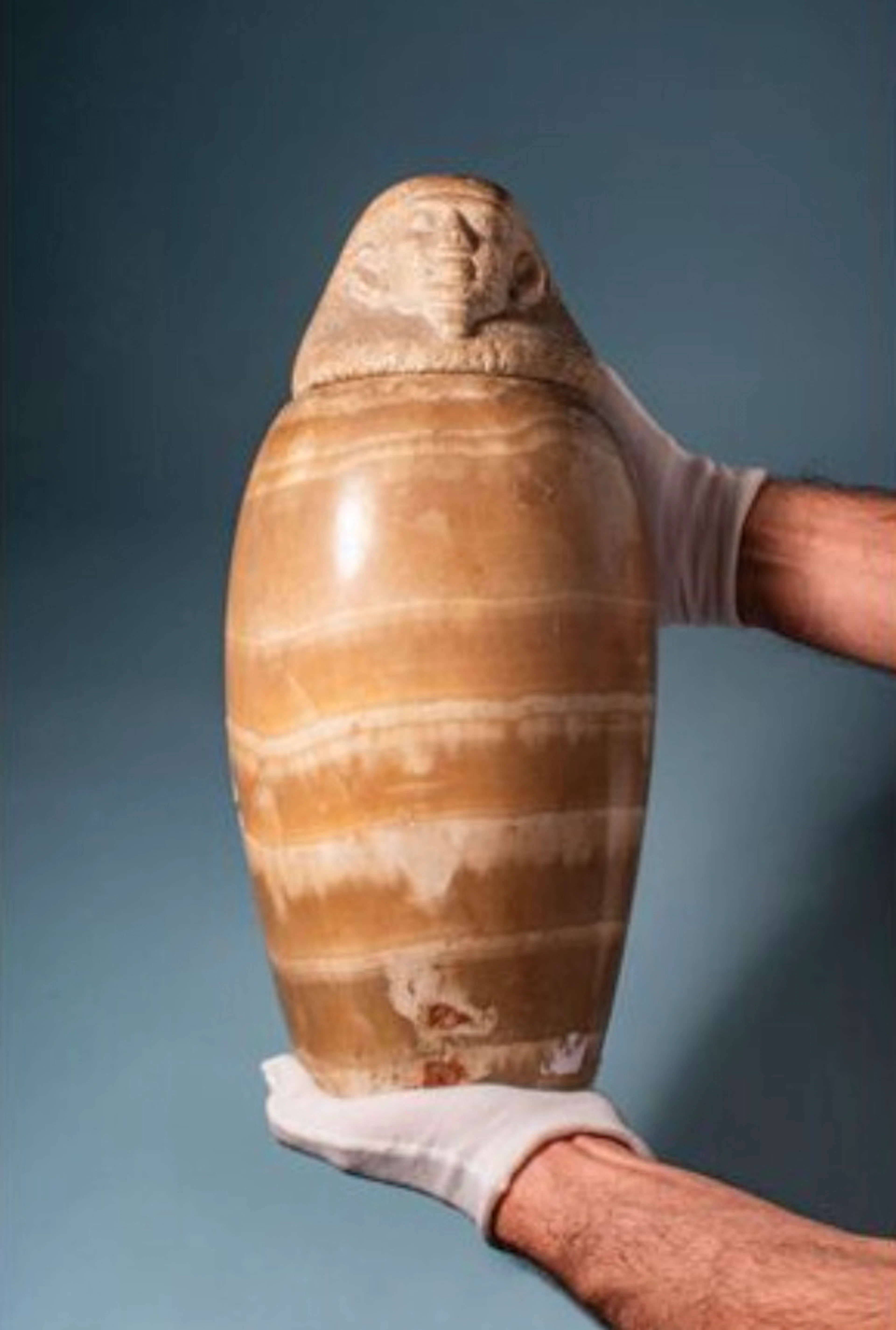 RARE EGYPTIAN ALABASTER CANOPIC JAR WITH HUMAN-HEADED LID (IMSETY)