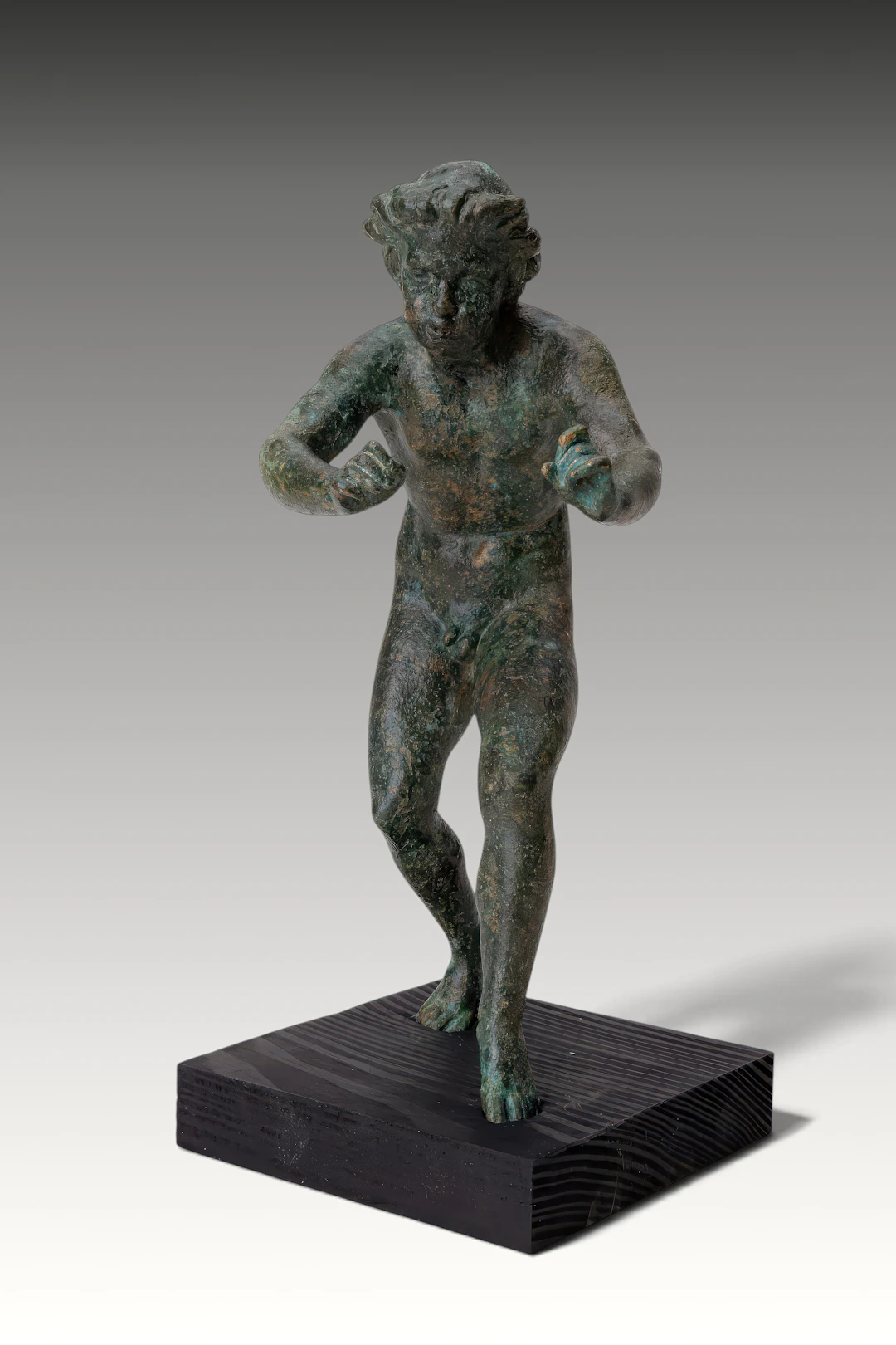 RARE ROMAN BRONZE FIGURINE OF A MUSICIAN PLAYING A FLUTE