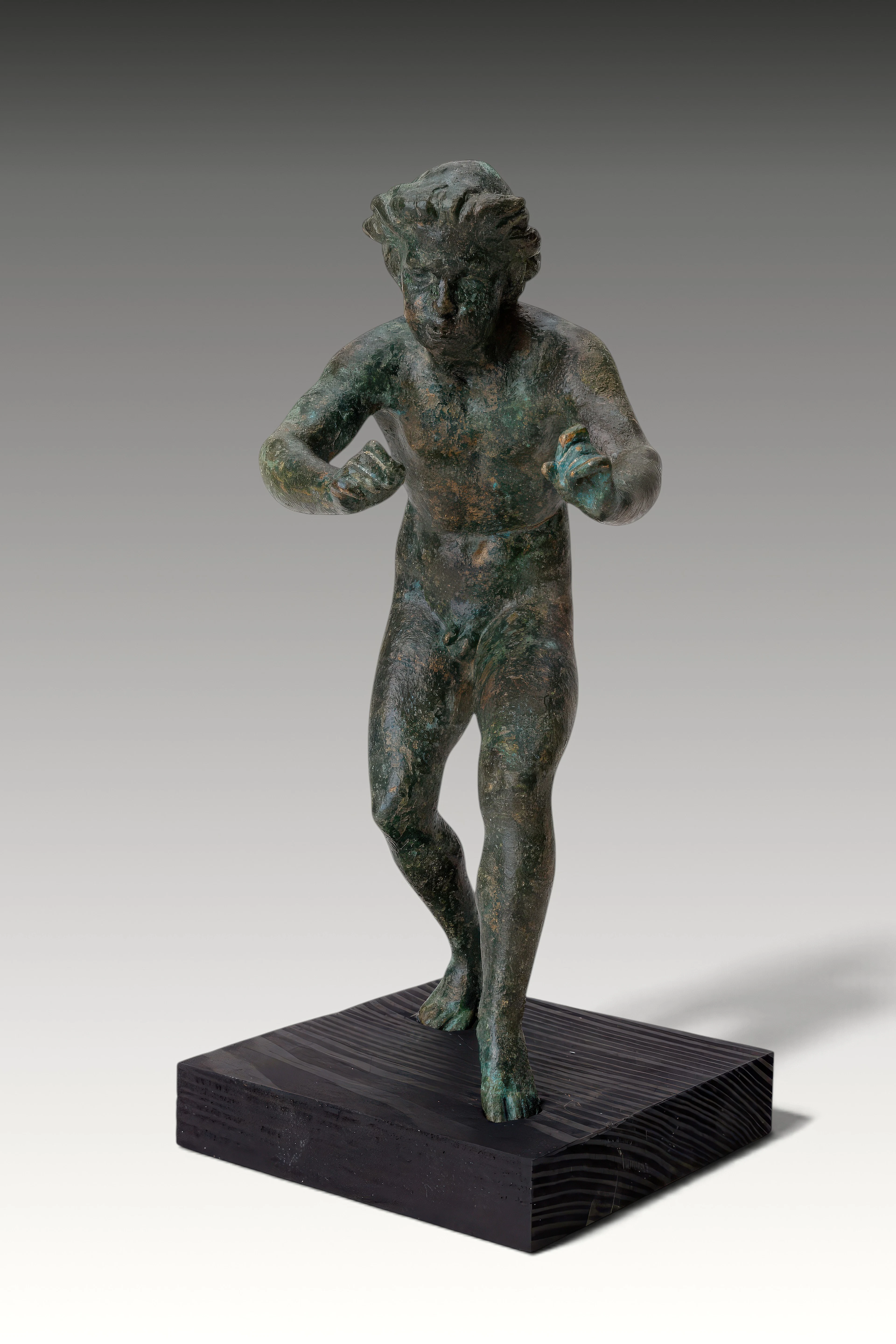 RARE ROMAN BRONZE FIGURINE OF A MUSICIAN PLAYING A FLUTE