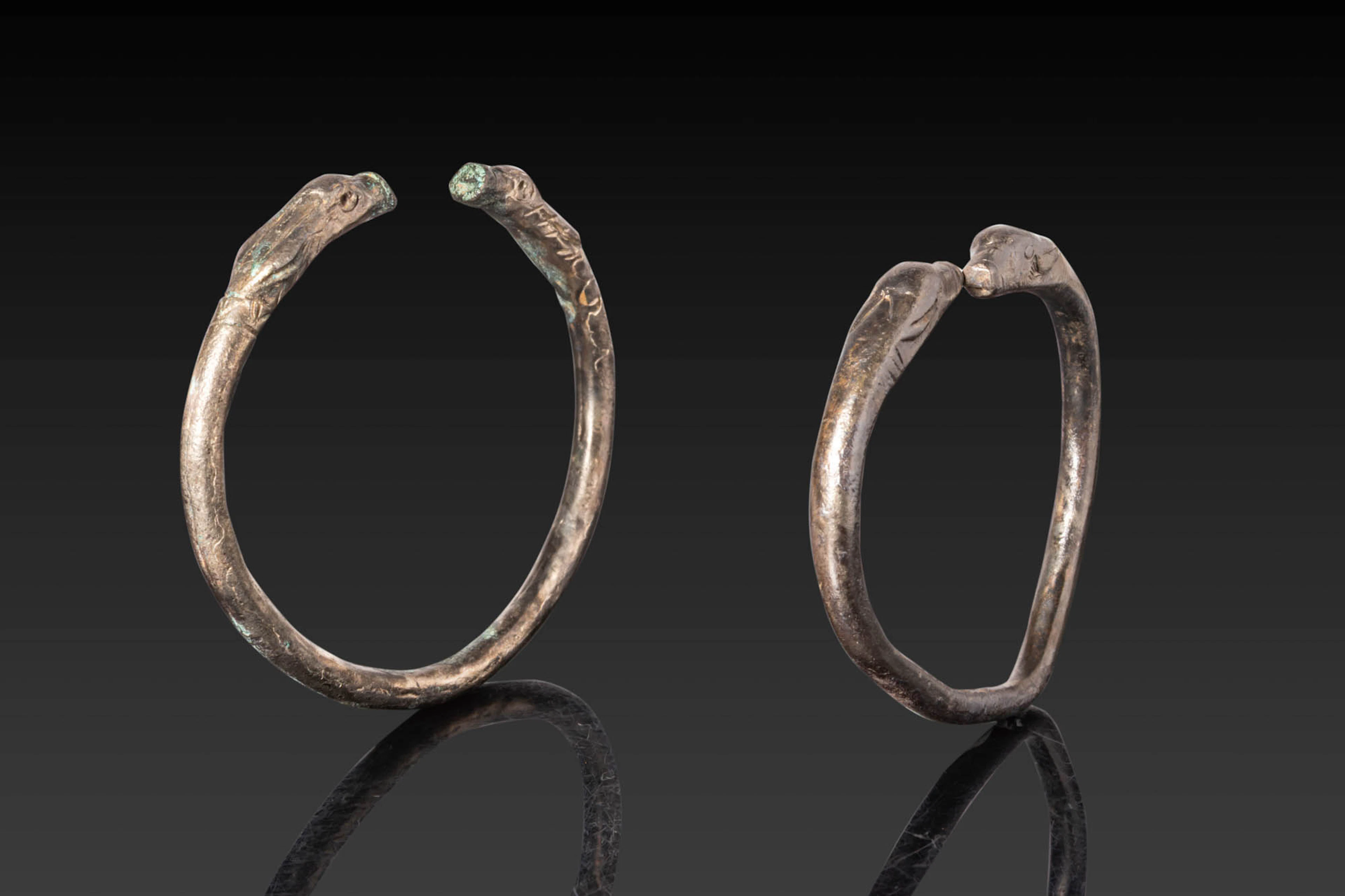 PAIR OF GREEK PERIOD BRONZE BRACELETS WITH ANIMAL HEADS