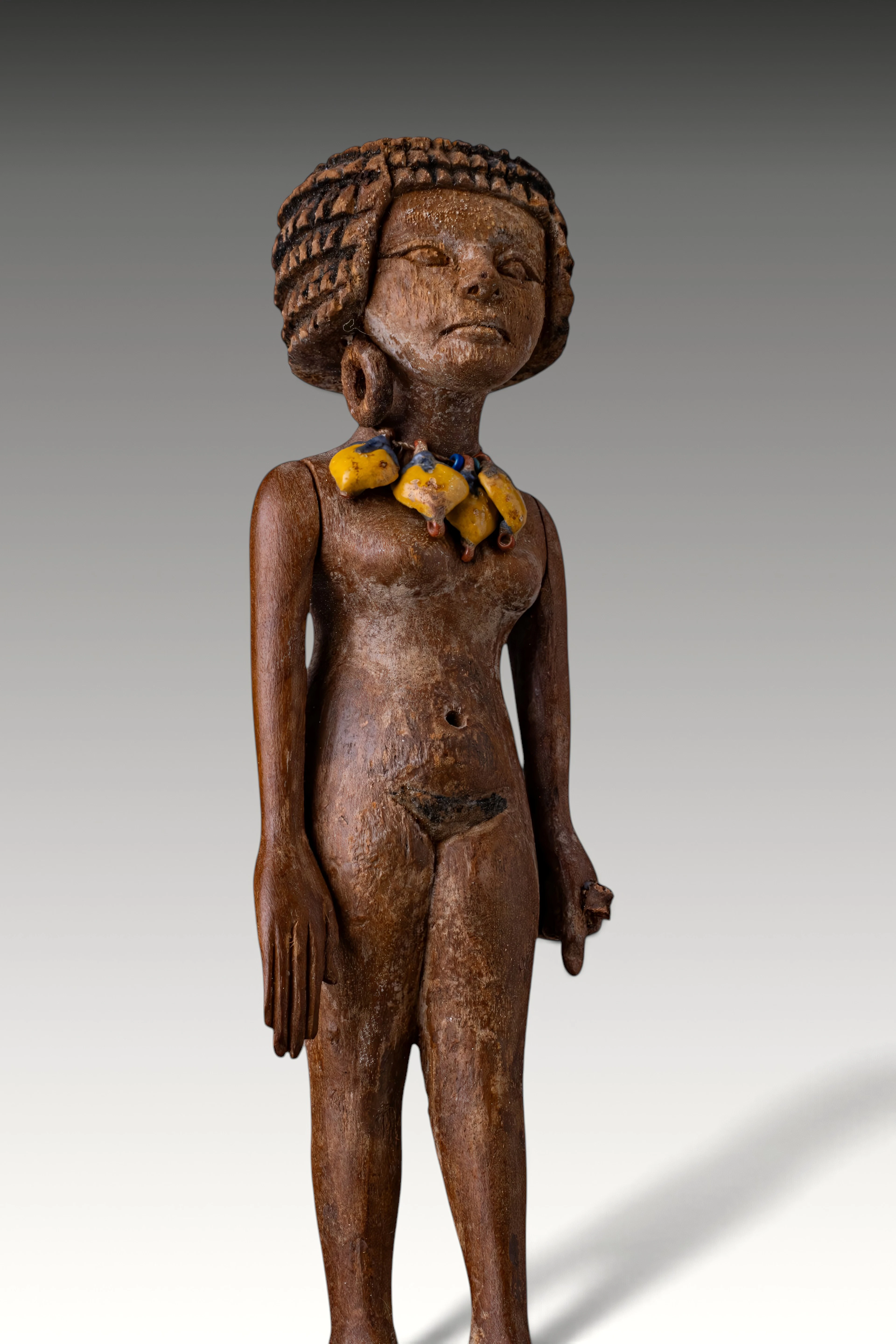 VERY RARE EGYPTIAN WOODEN FIGURINE OF A STANDING WOMAN WITH FAIENCE COLLAR