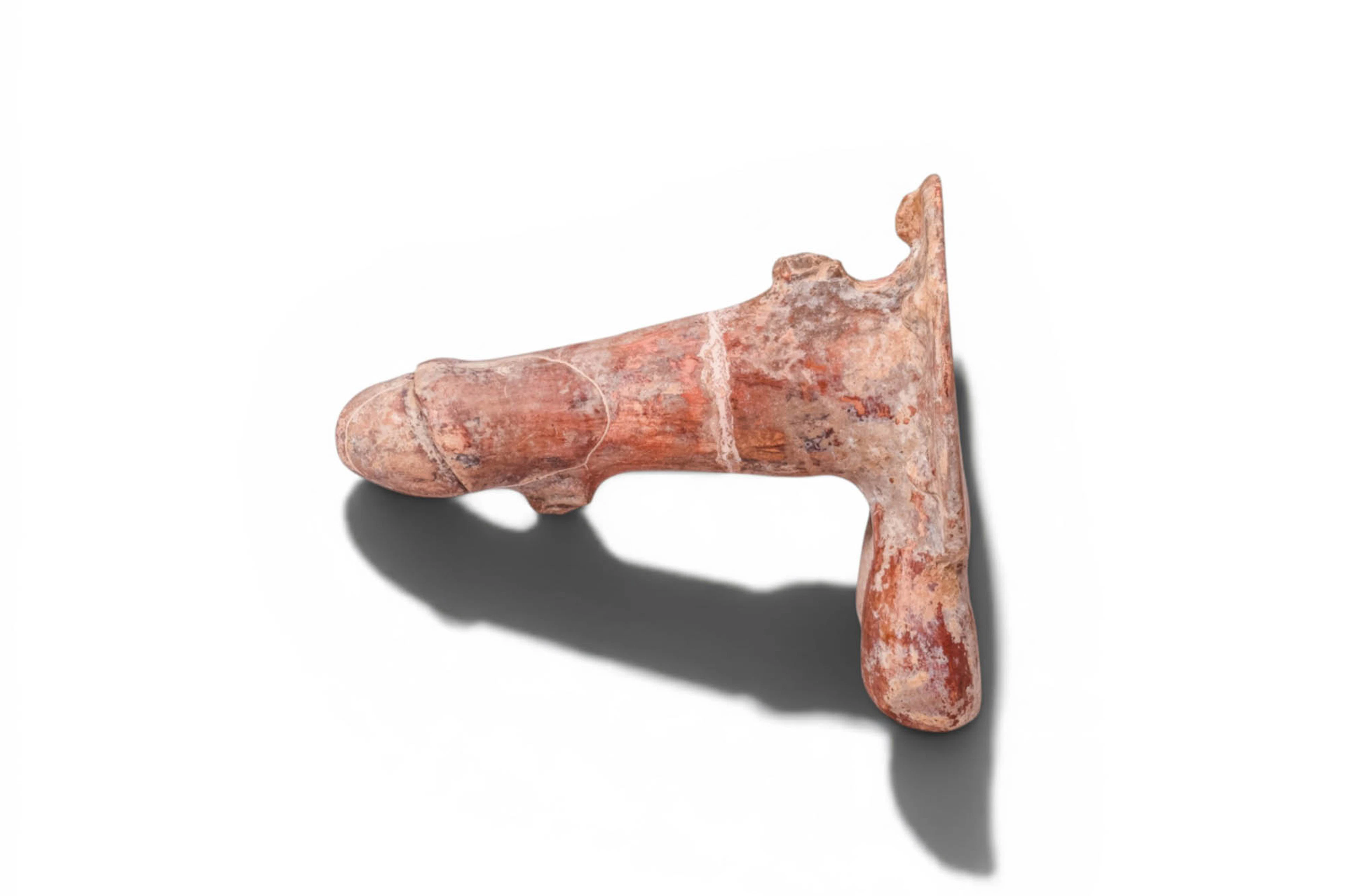 ETRUSCAN (or later) PHALLIC AMULET WITH APOTROPAIC MASKS