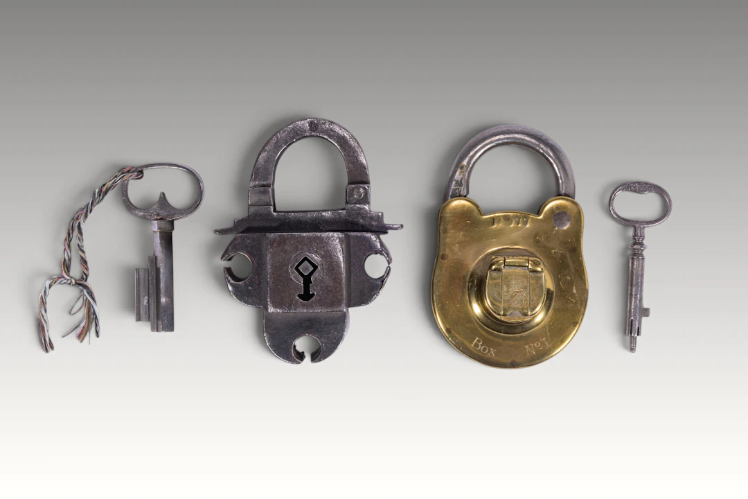 TWO VINTAGE PADLOCKS AND KEYS