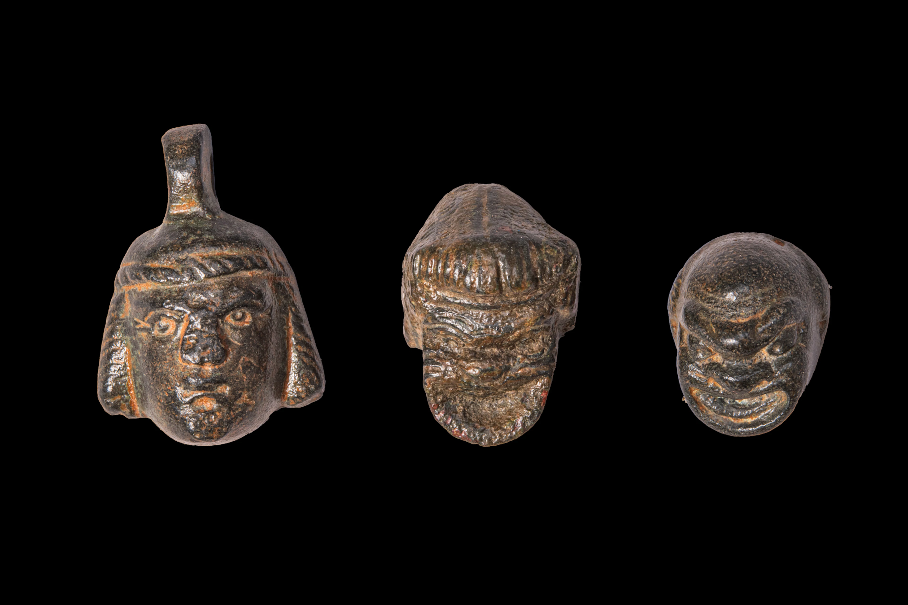 COLLECTION OF ROMAN BRONZE THEATRICAL MASKS