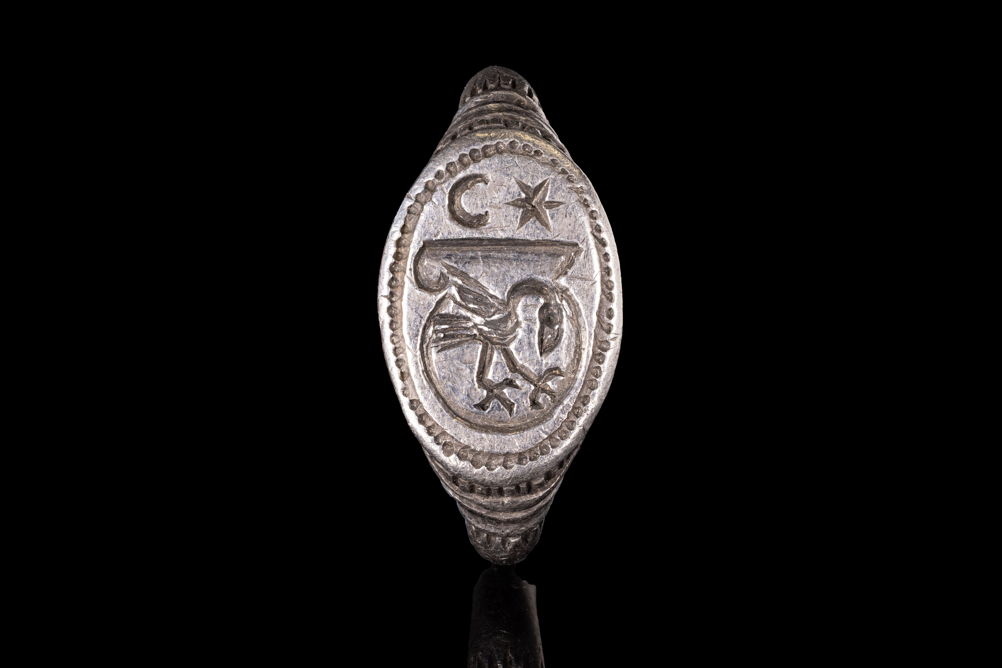 MEDIEVAL SOLID SILVER HERALDIC RING WITH A BIRD UNDER THE MOON AND STAR