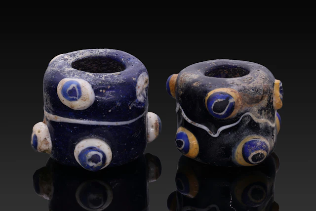 PAIR OF PHOENICIAN GLASS EYE BEADS