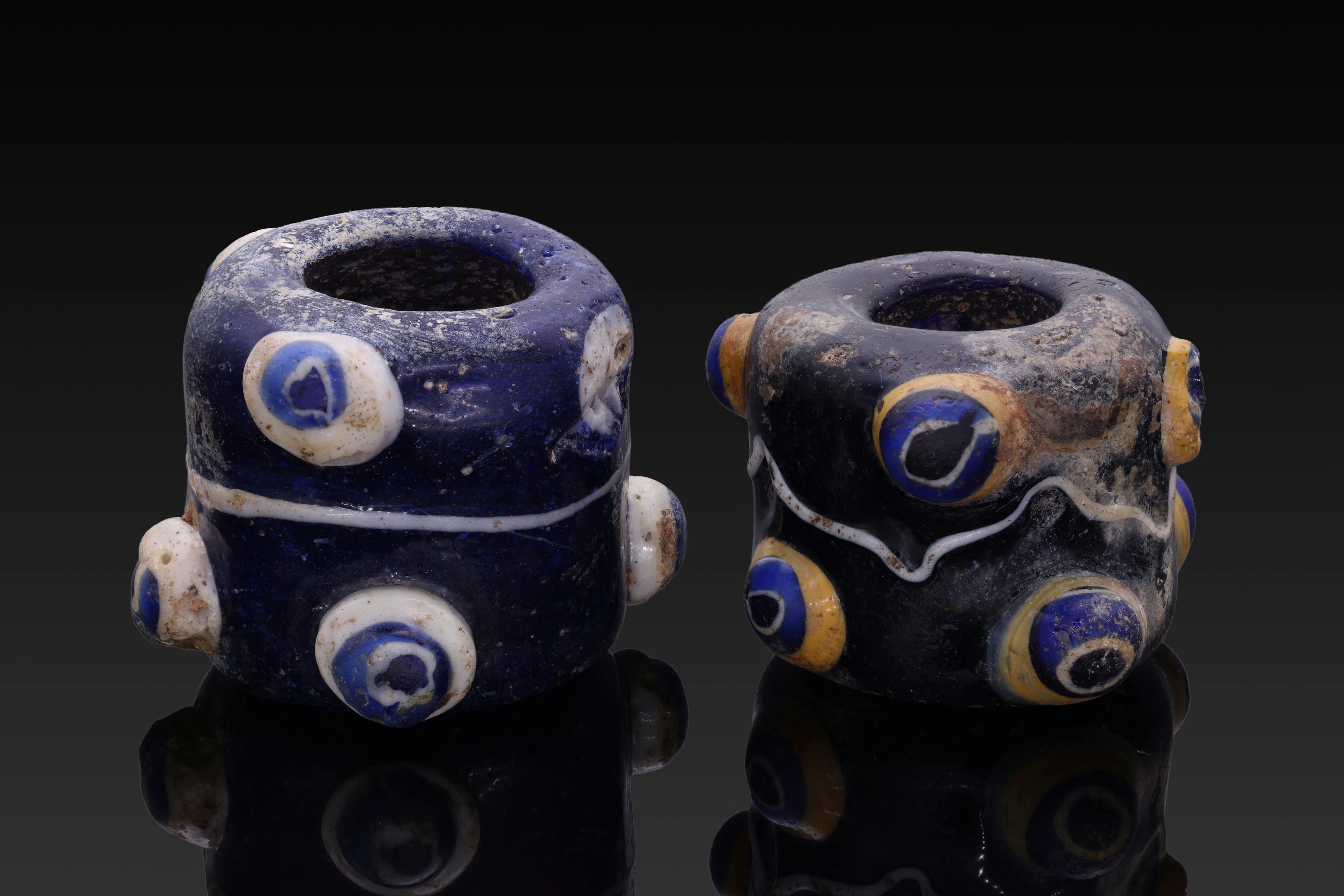 PAIR OF PHOENICIAN GLASS EYE BEADS