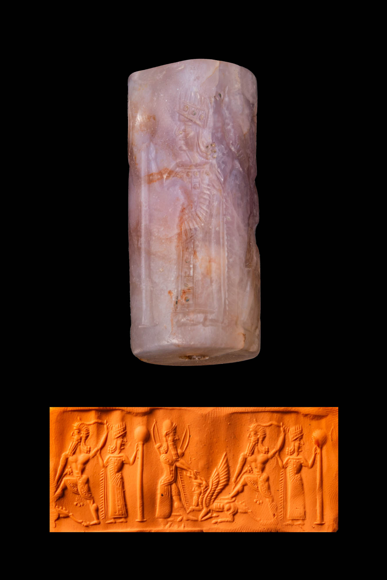 MESOPOTAMIAN AMETHYST CYLINDER SEAL WITH A SMITING HERO AND ATTENDANT FIGURES