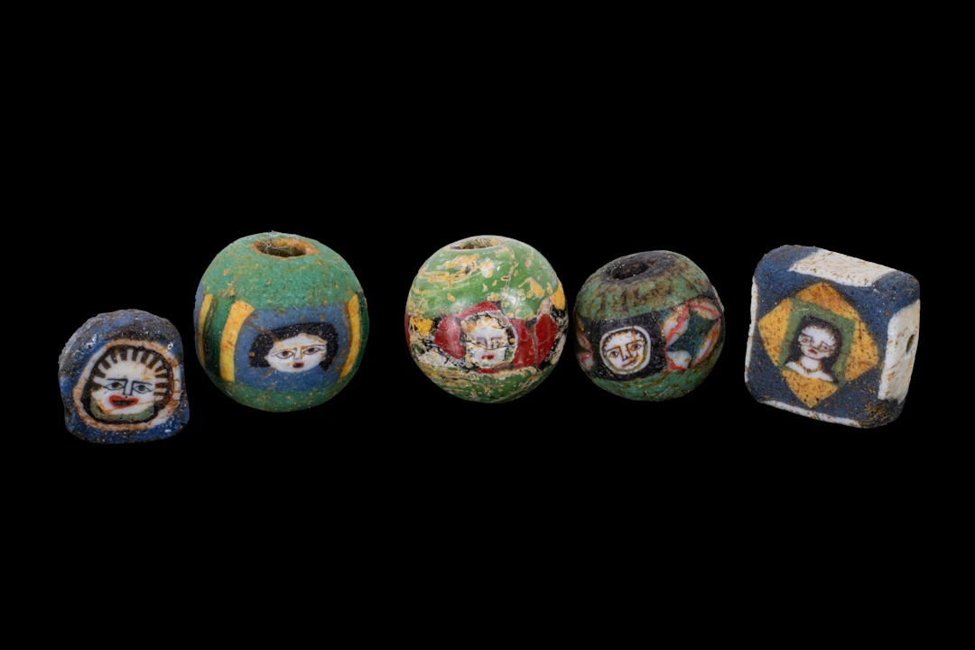 COLLECTION OF ROMAN MOSAIC GLASS BEADS WITH FACES