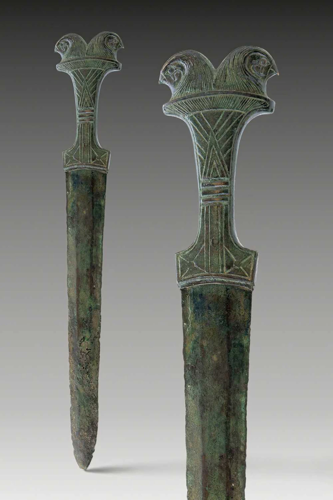 EGYPTIAN BRONZE DAGGER WITH DOUBLE FALCON-HEADED POMMEL