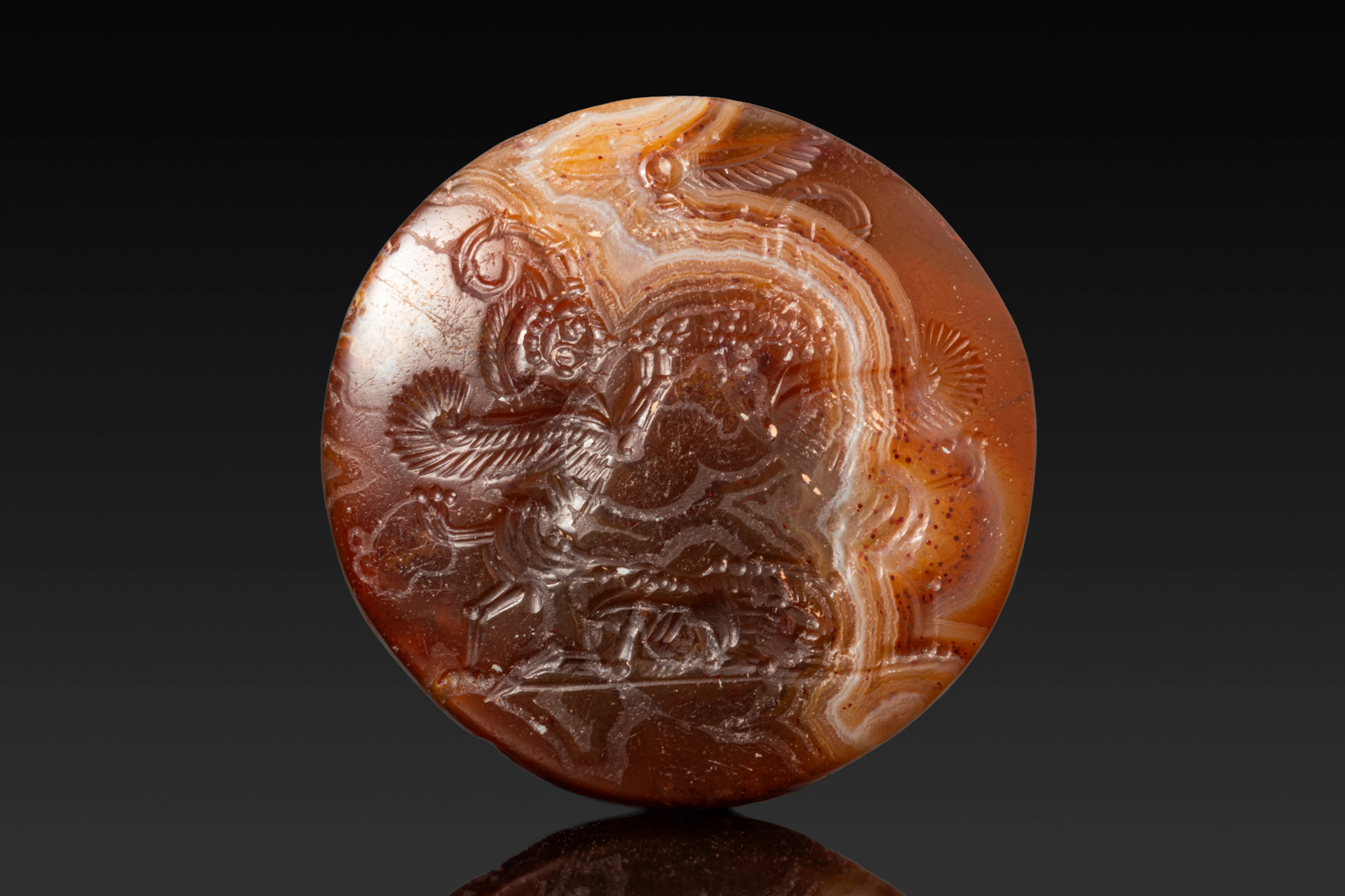 NEO-ASSYRIAN AGATE SEAL WITH RAMPANT WINGED LIONS
