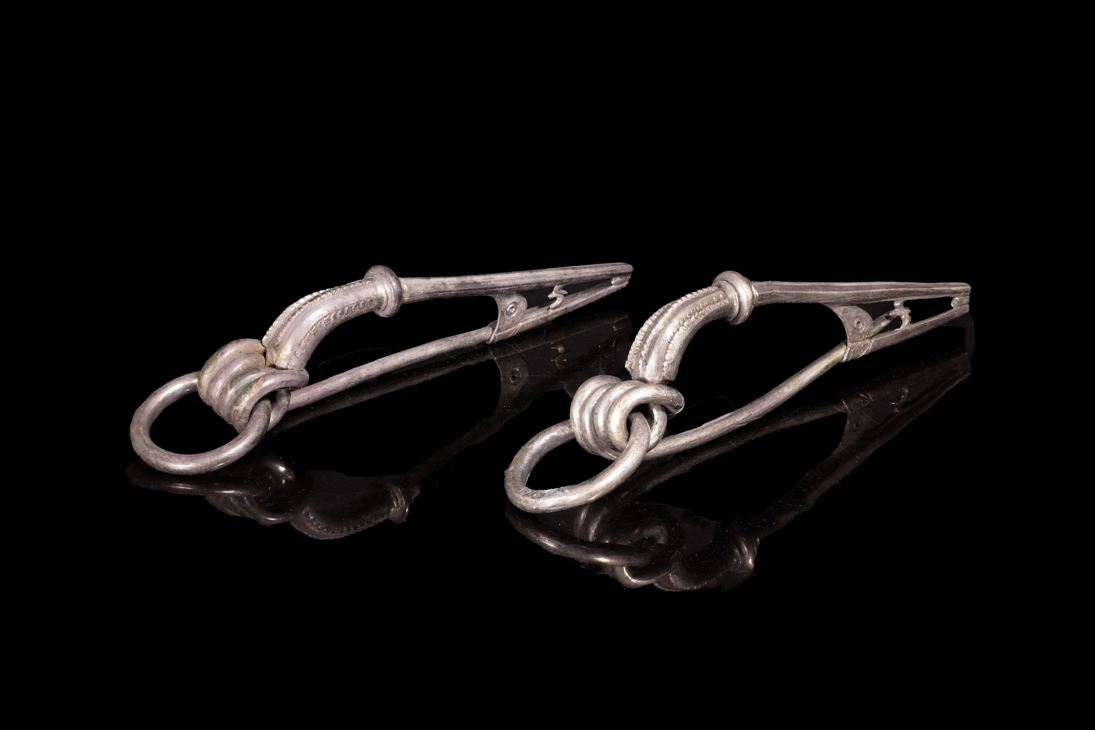 PAIR OF CELTIC SILVER BROOCHES