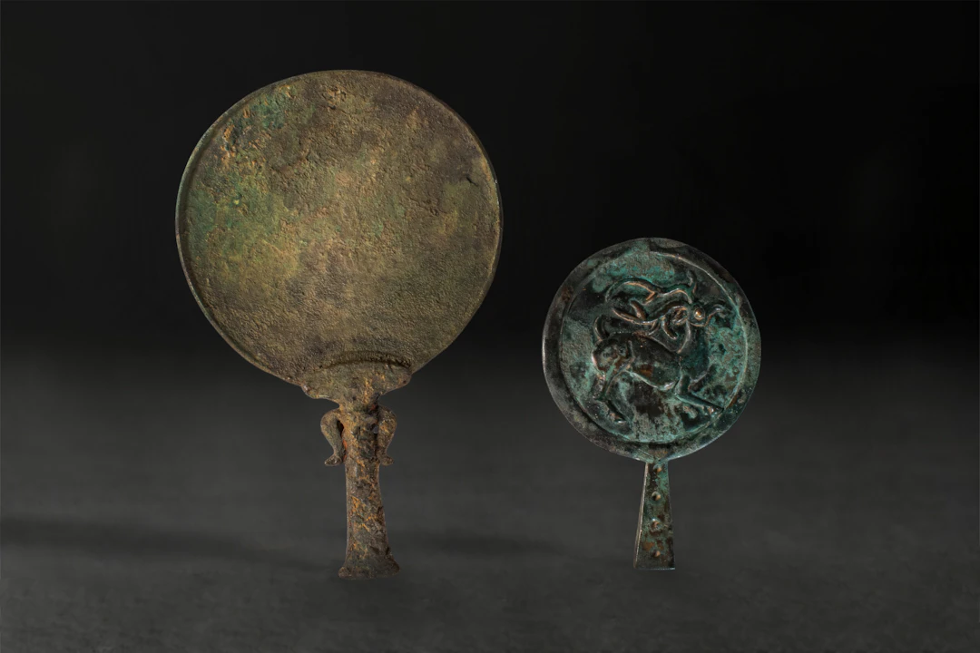 PAIR OF NEAR EASTERN BRONZE MIRRORS