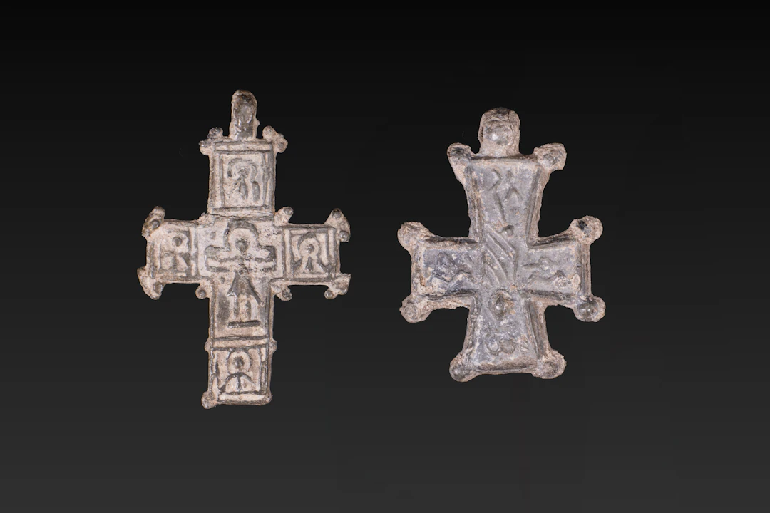 PAIR OF BYZANTINE LEAD CROSS PENDANTS